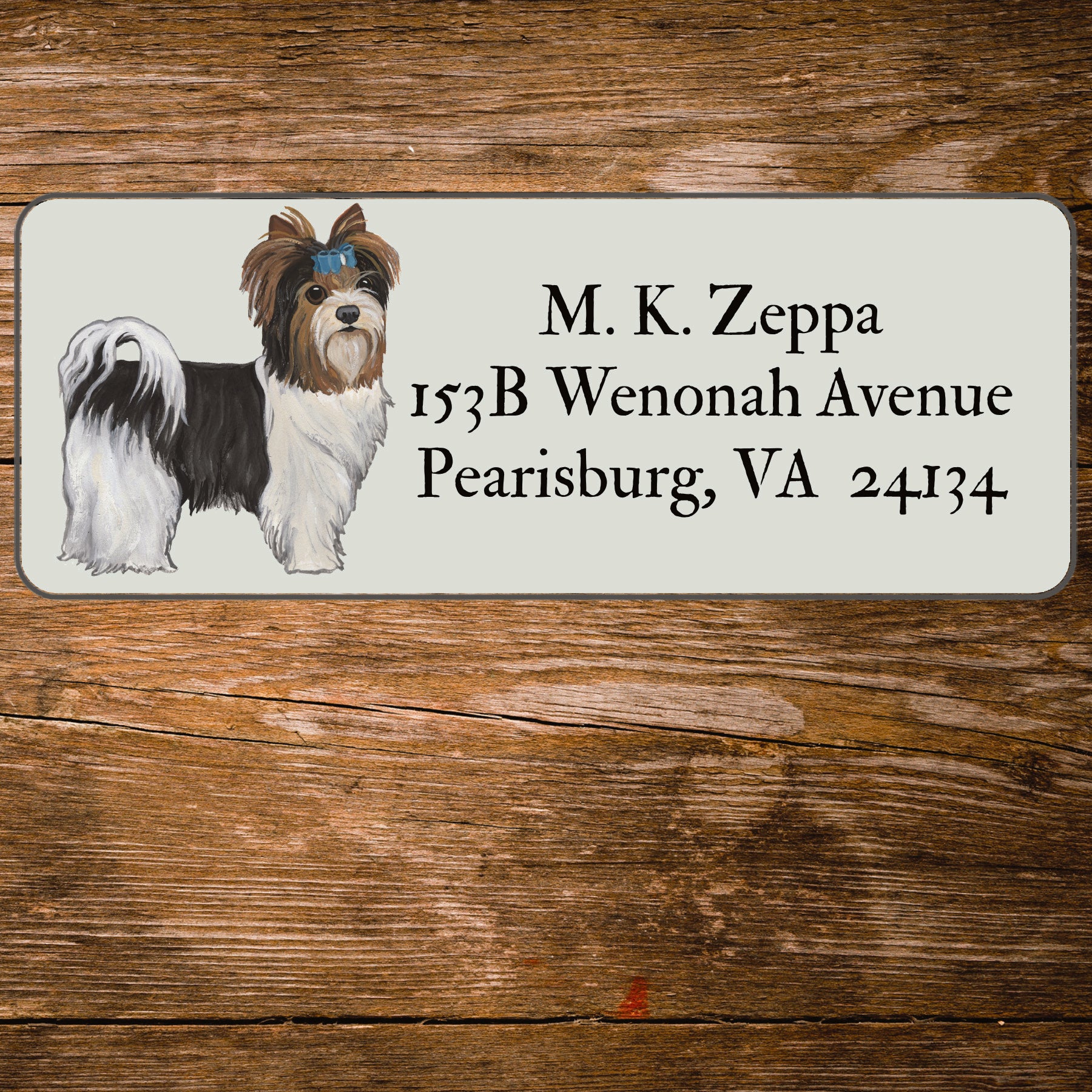 Return address label with an illustration of a Biewer Terrier