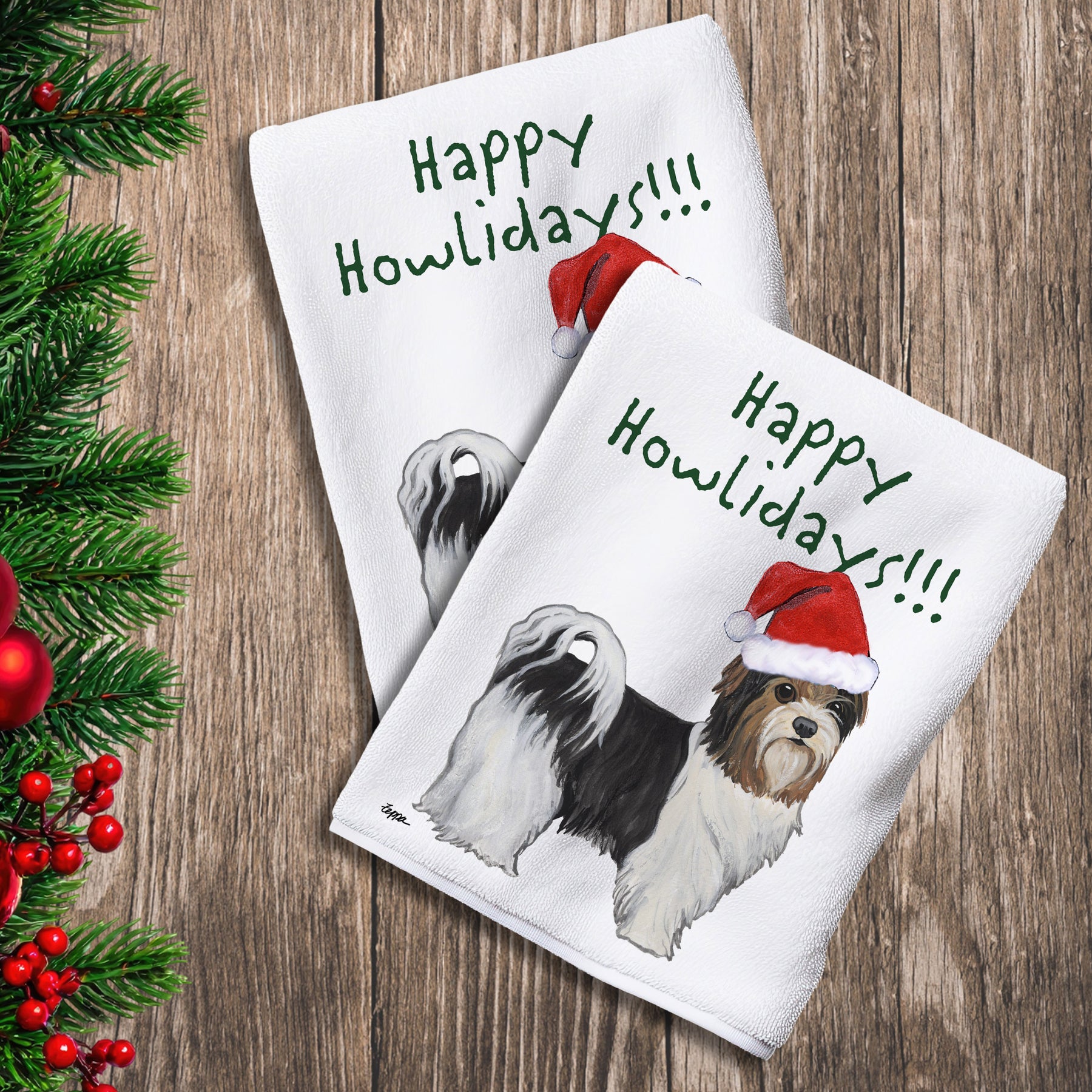 2 Kitchen Towels with a Biewer Terrier with a puppy clip in a Santa Hat and Happy Howlidays text.