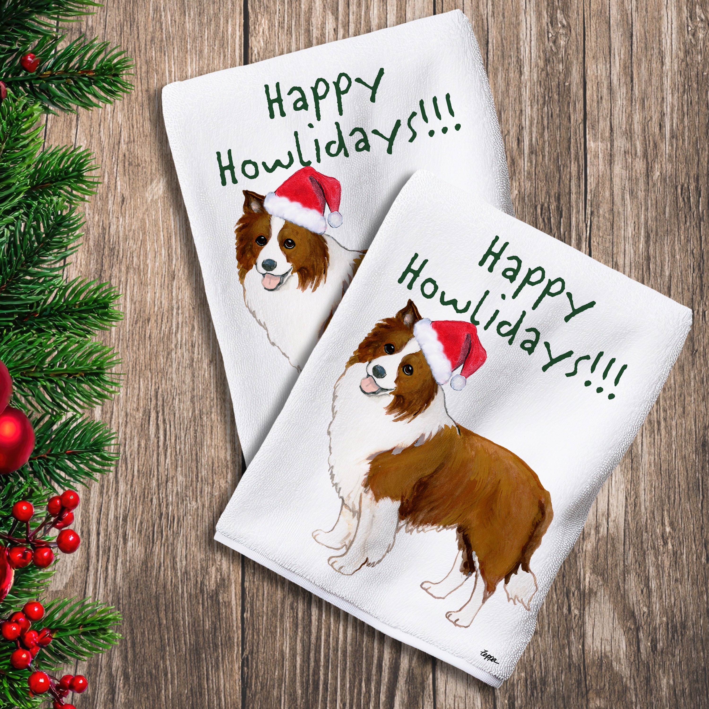2 Kitchen Towels with a brown and white Border Collie in a Santa Hat and Happy Howlidays text.