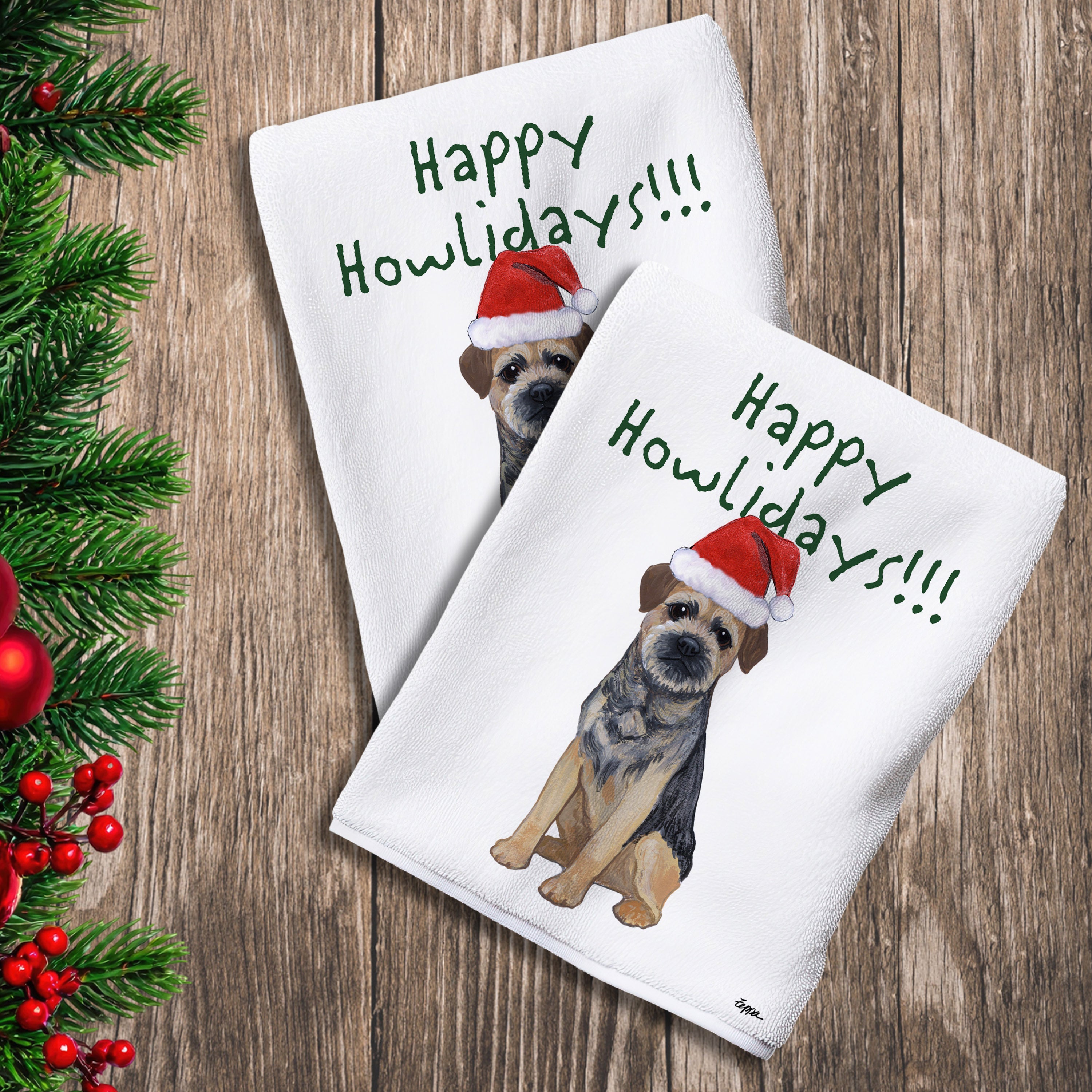 2 Kitchen Towels with a Border Terrier in a Santa Hat and Happy Howlidays text.