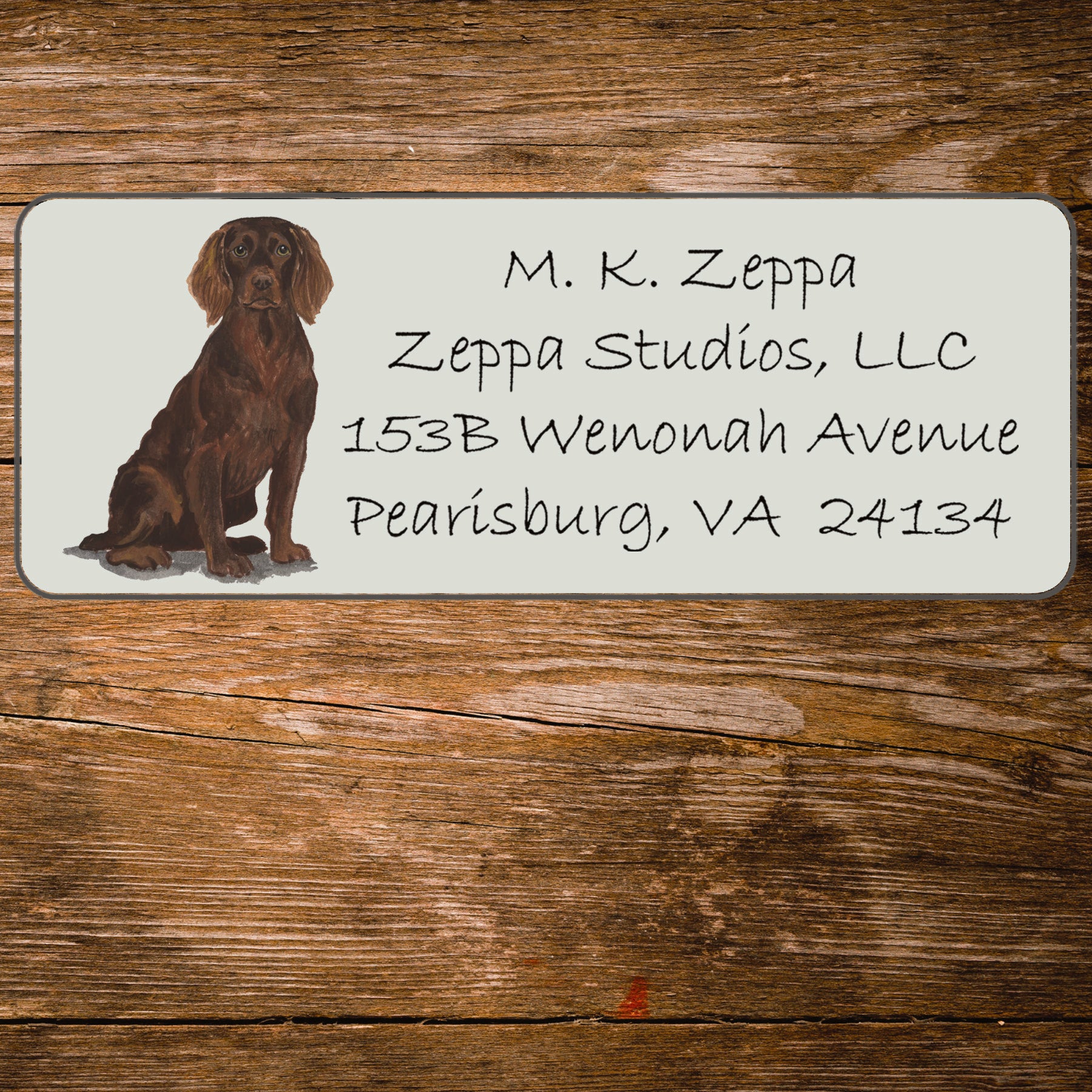 Return address label with a Boykin Spaniel illustration.