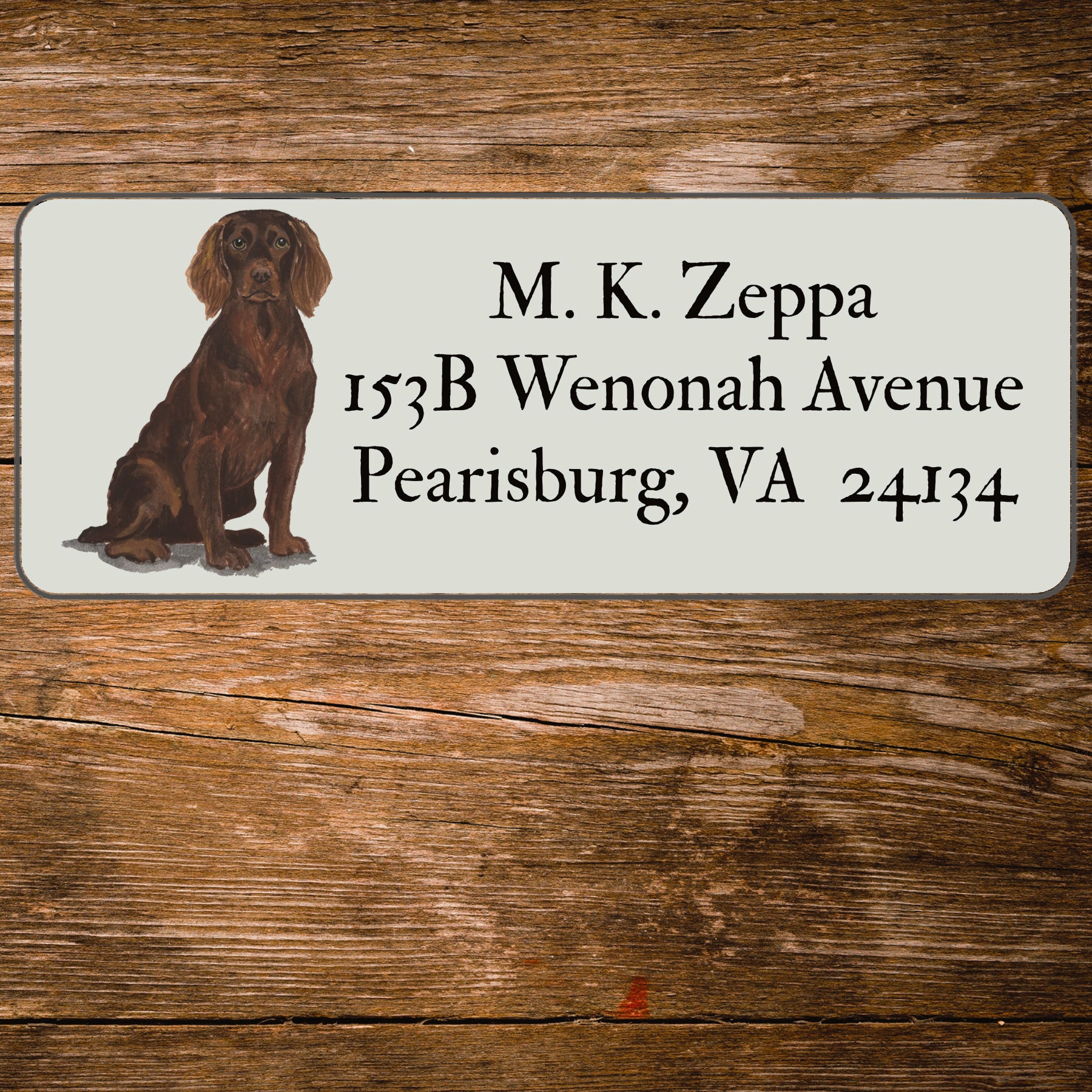 Return address label with a Boykin Spaniel illustration.