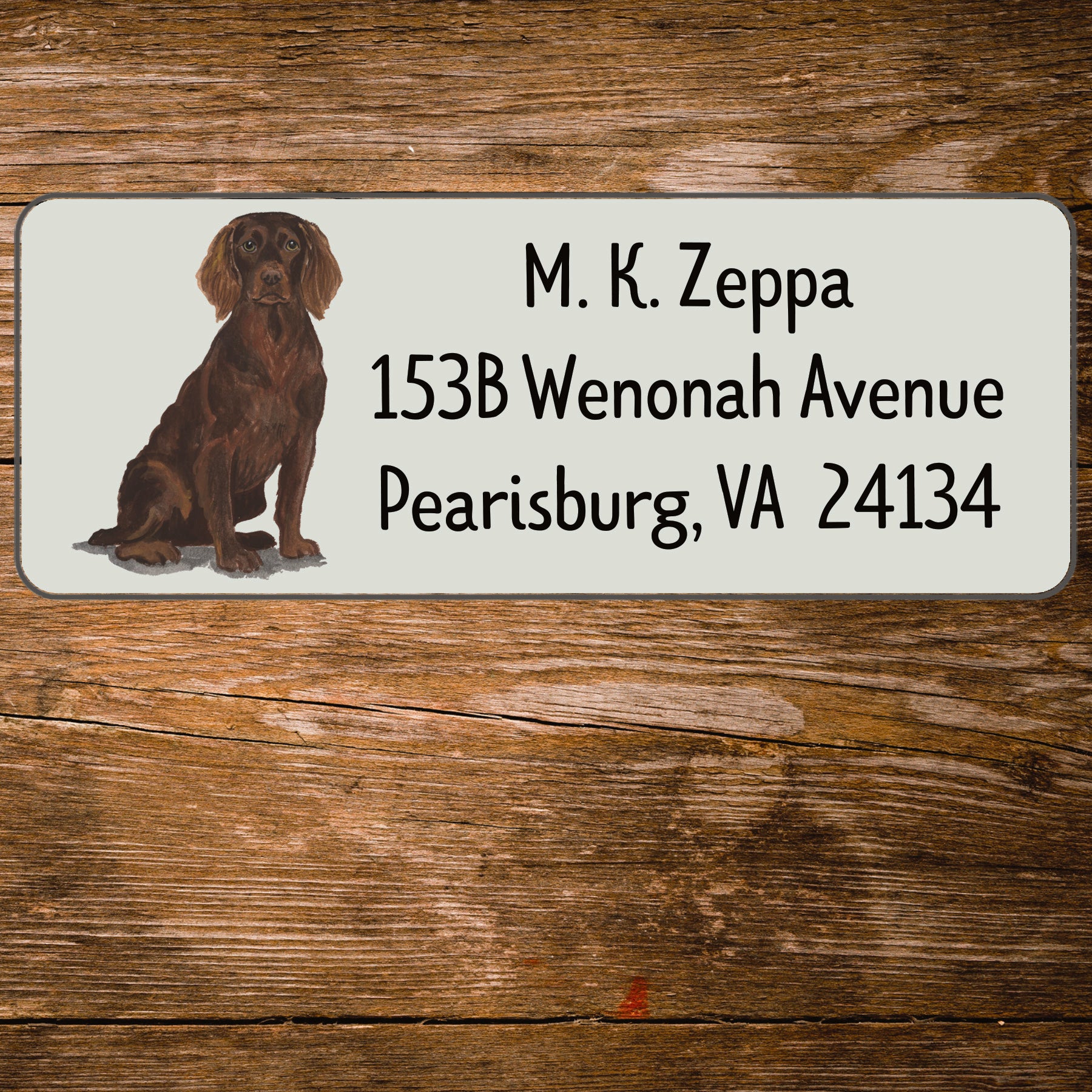 Return address label with a Boykin Spaniel illustration.
