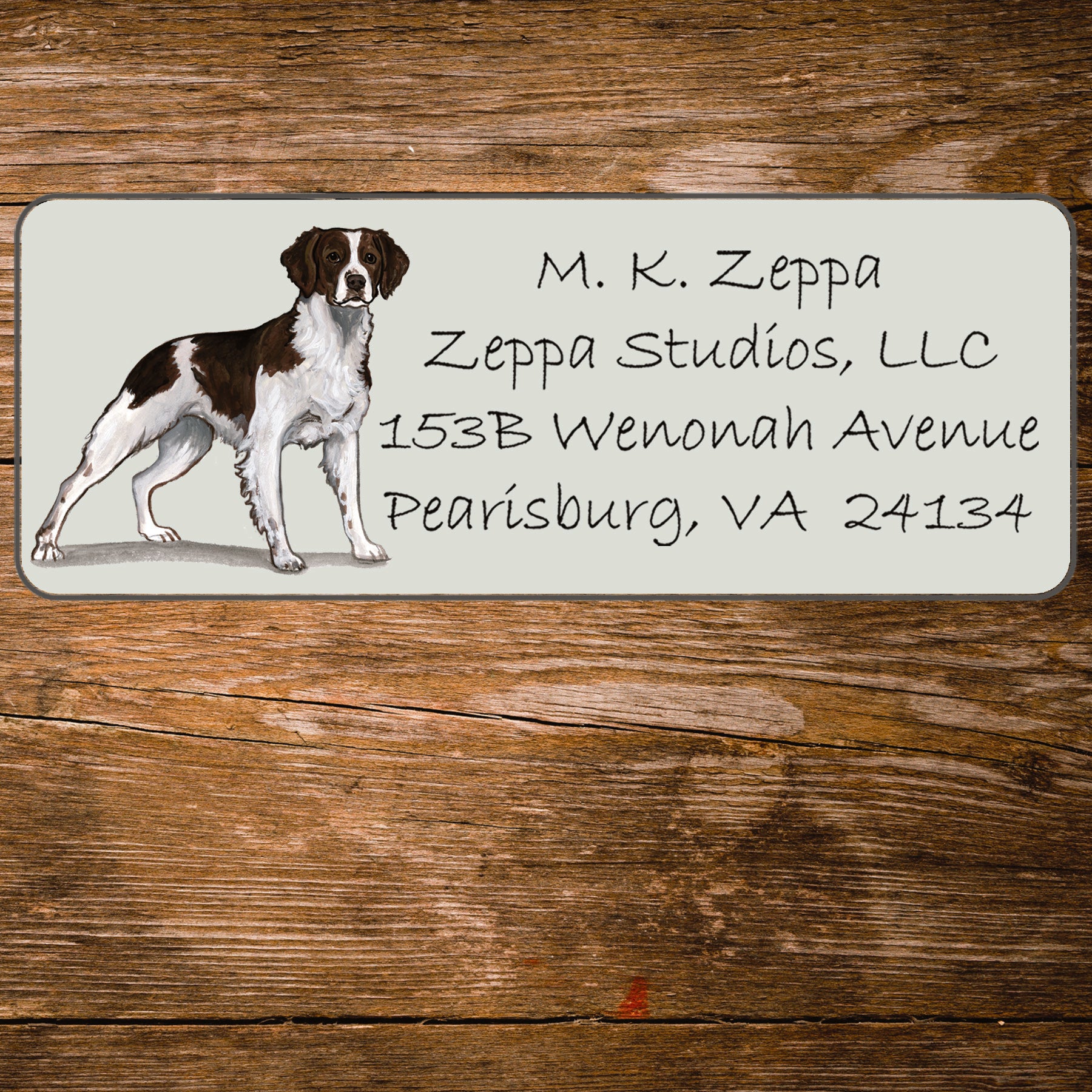Return address label with a Brittany illustration.