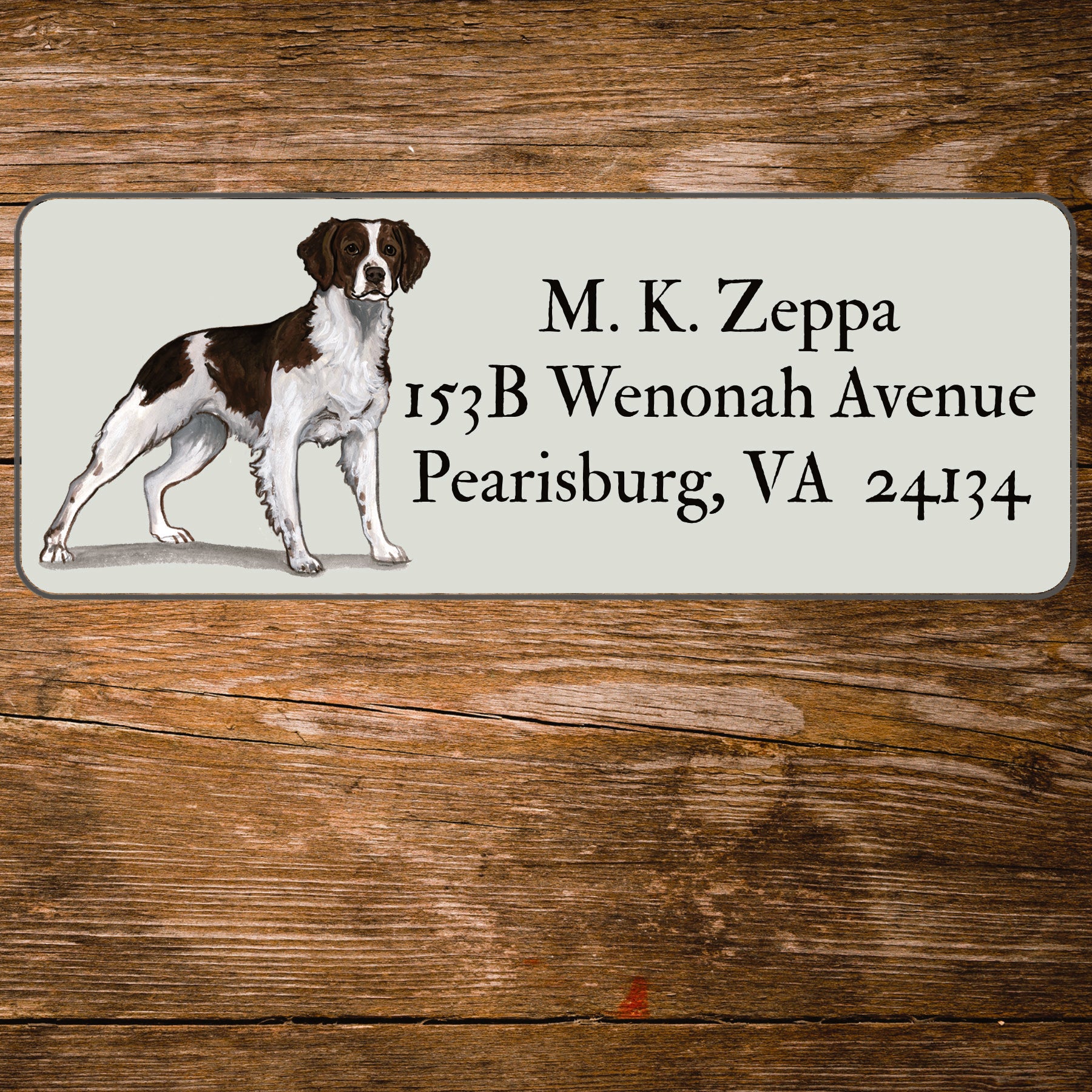 Return address label with a Brittany illustration.