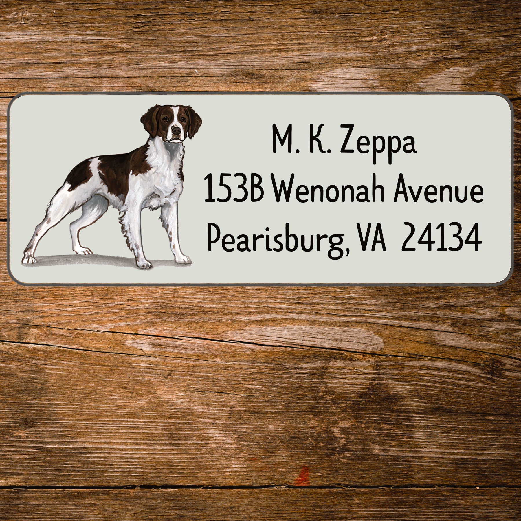 Return address label with a Brittany illustration.