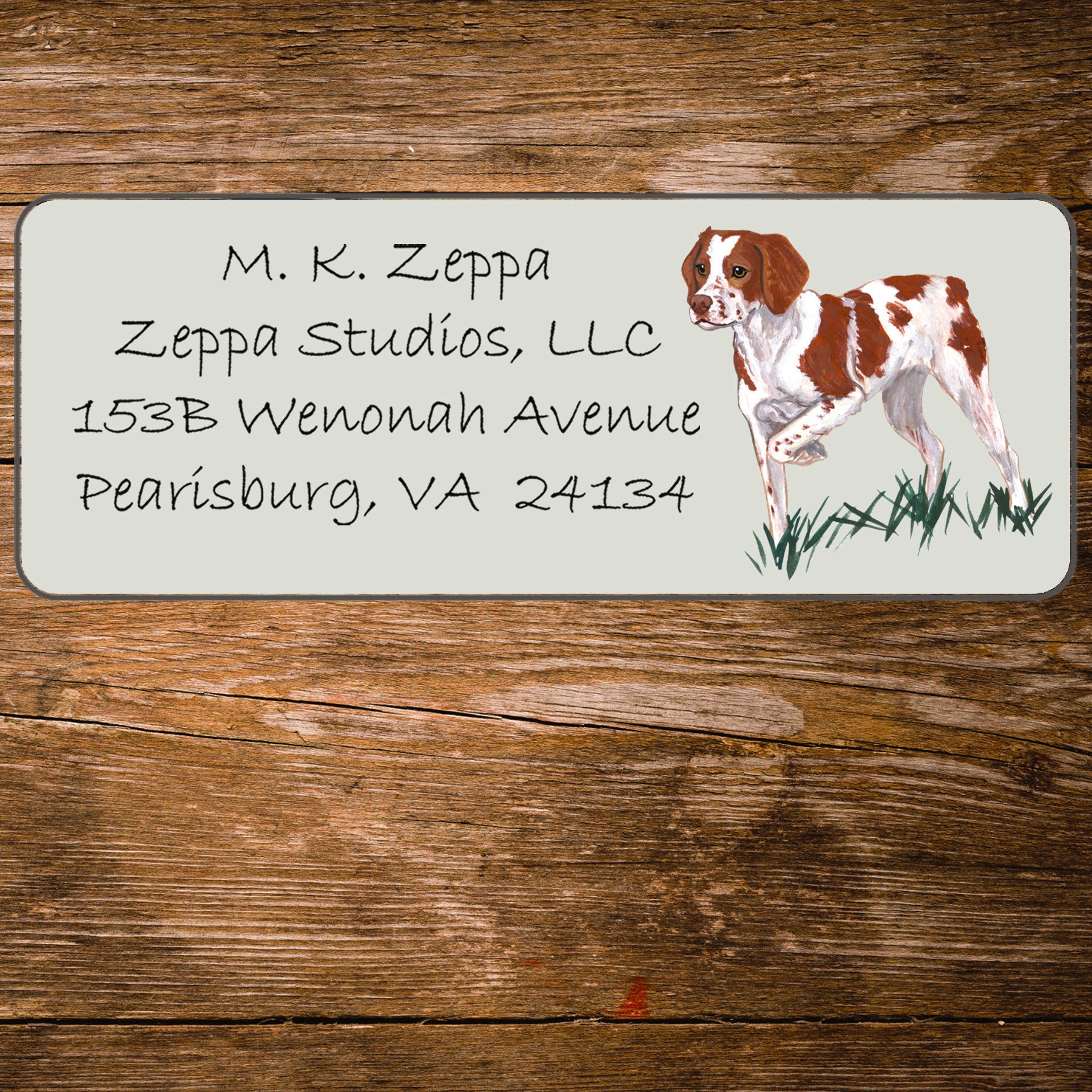 Return address label with a Brittany illustration.