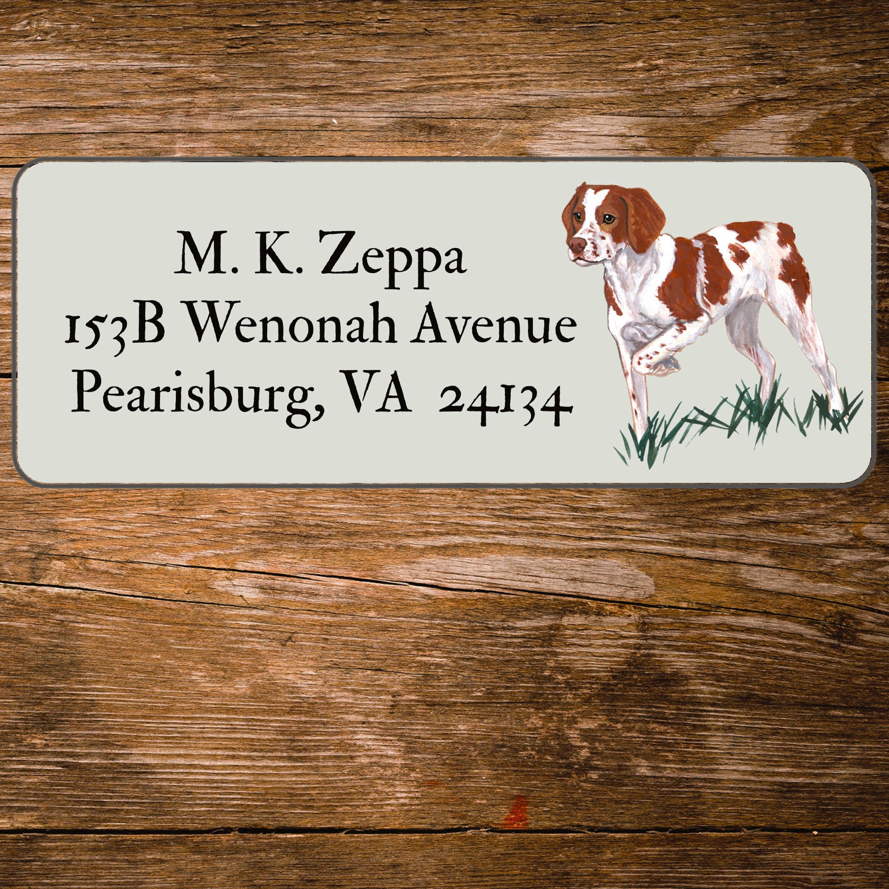 Return address label with a Brittany illustration.