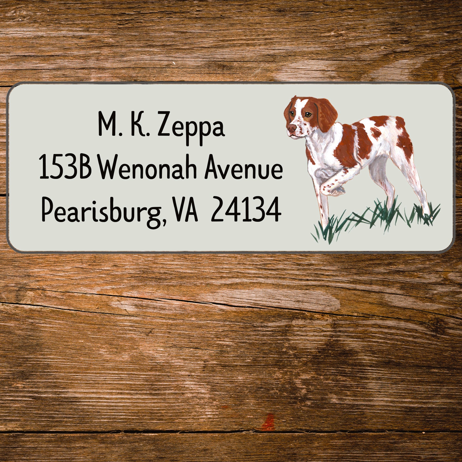Return address label with a Brittany illustration.