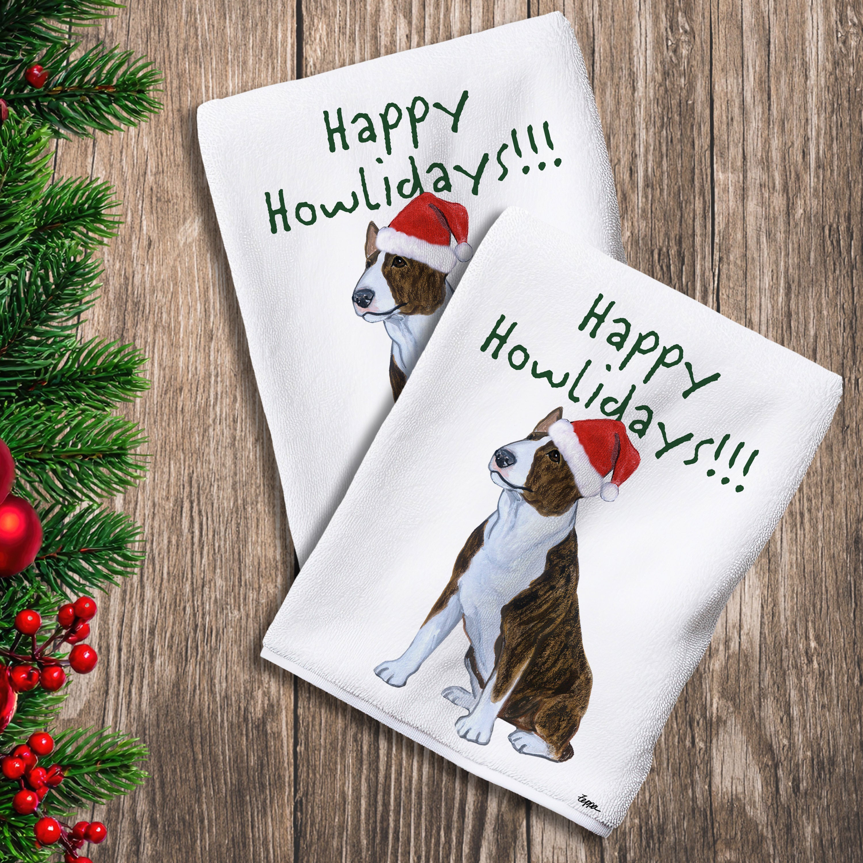 2 Kitchen Towels with a brindle and white Bull Terrier in a Santa Hat and Happy Howlidays text.