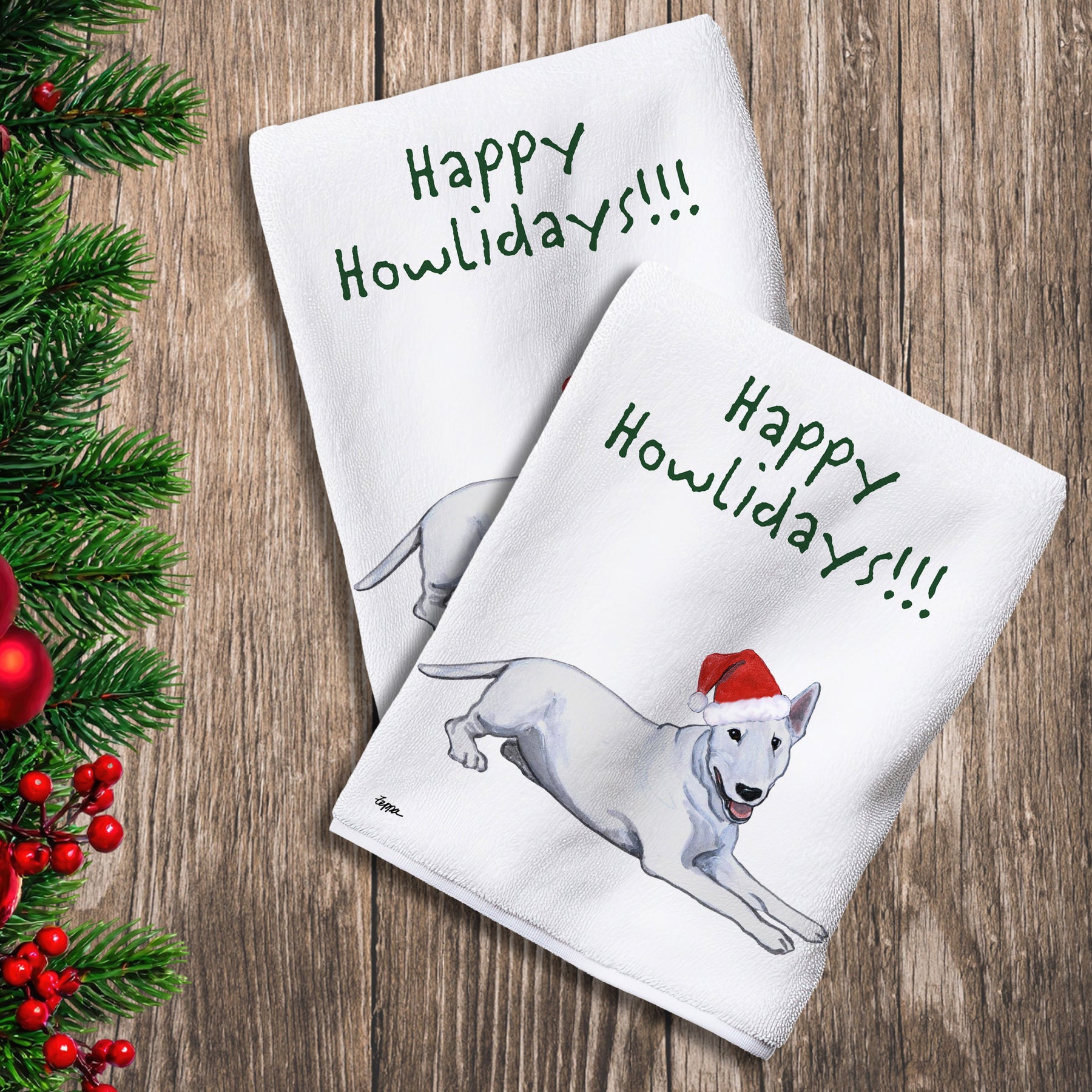 2 Kitchen Towels with a Bull Terrier in a Santa Hat and Happy Howlidays text.