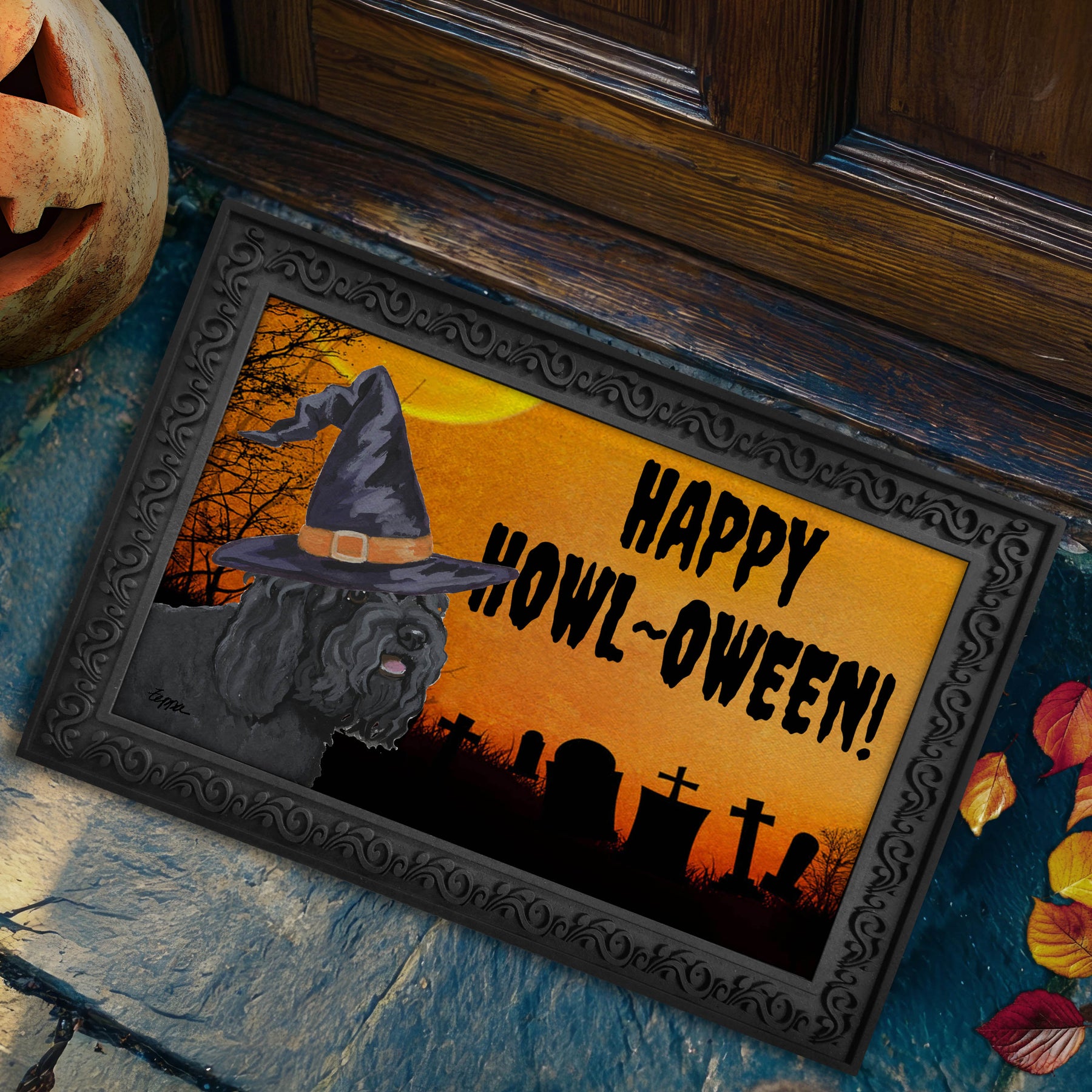 Barbet in a witch's hat on a Happy Howl-ween doormat.