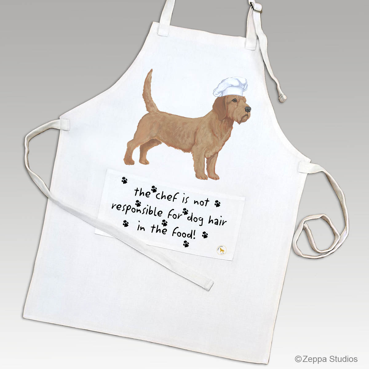 Linen chef's apron with a Basset Fauve de Bretagne in a chef's hat and a funny saying on the pocket.
