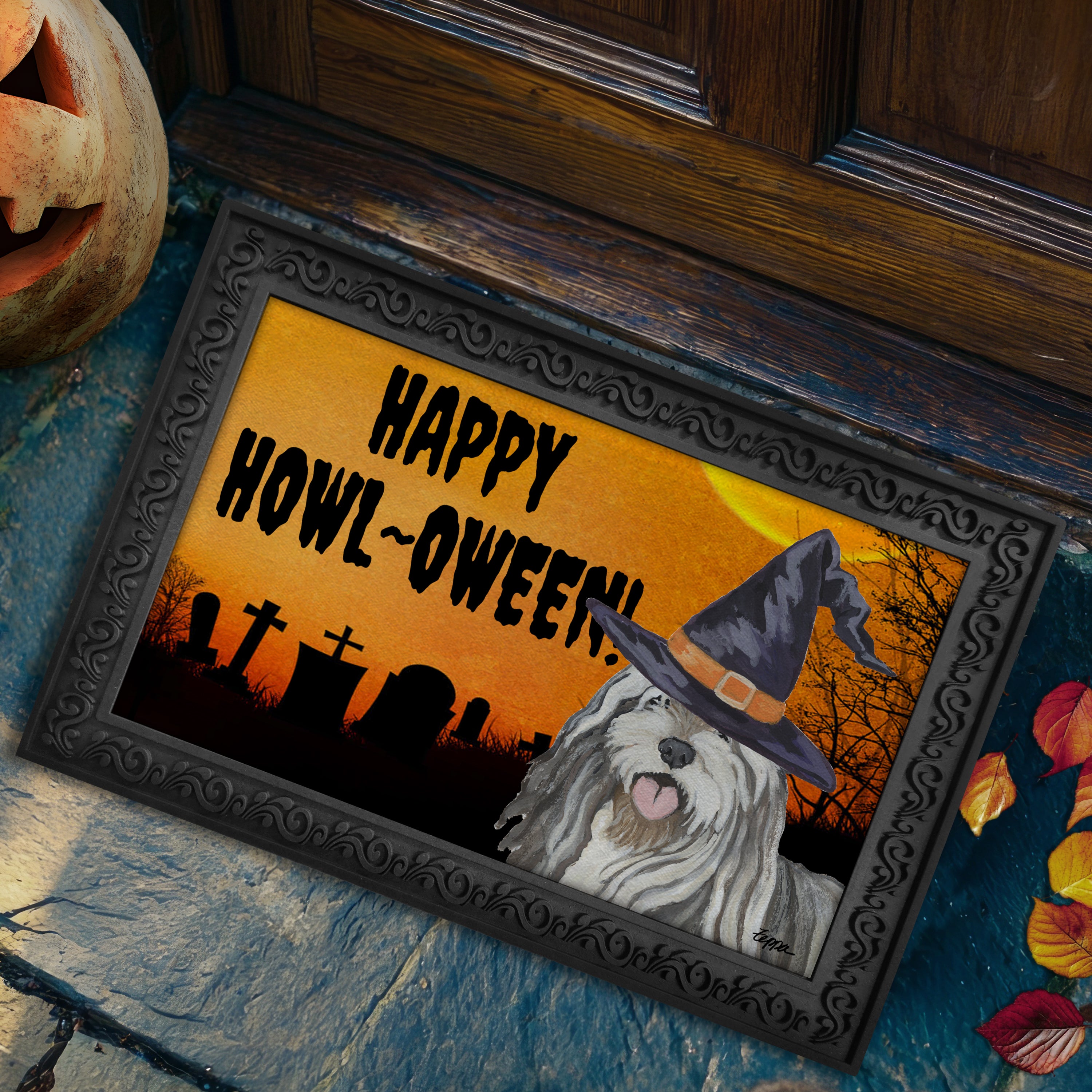 Halloween-themed doormat with a  Bergamasco wearing a witch hat and 'Happy Howl-Oween!' text, placed on a stone step.