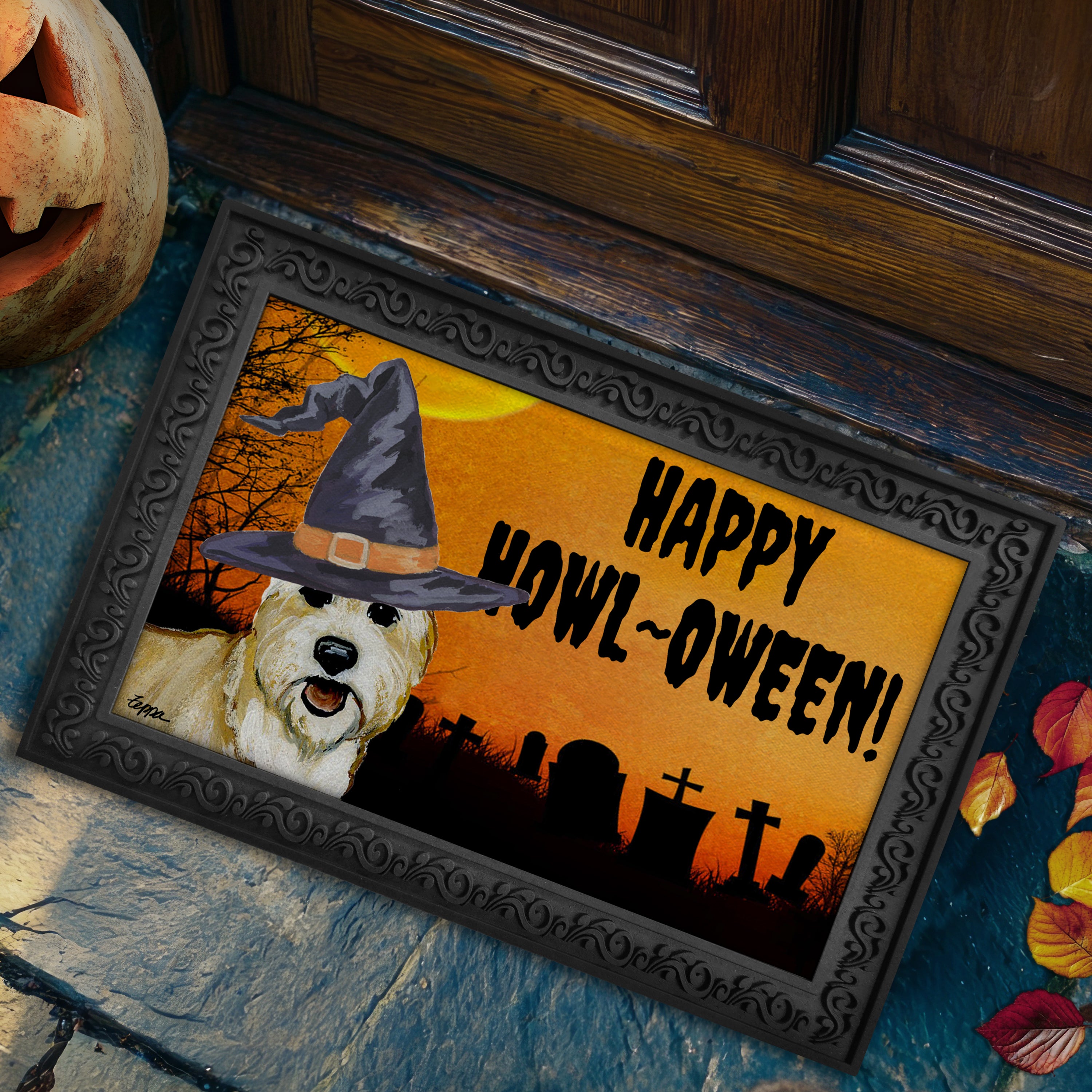 Berger Picard in a witch's hat on a Happy Howl-ween doormat.