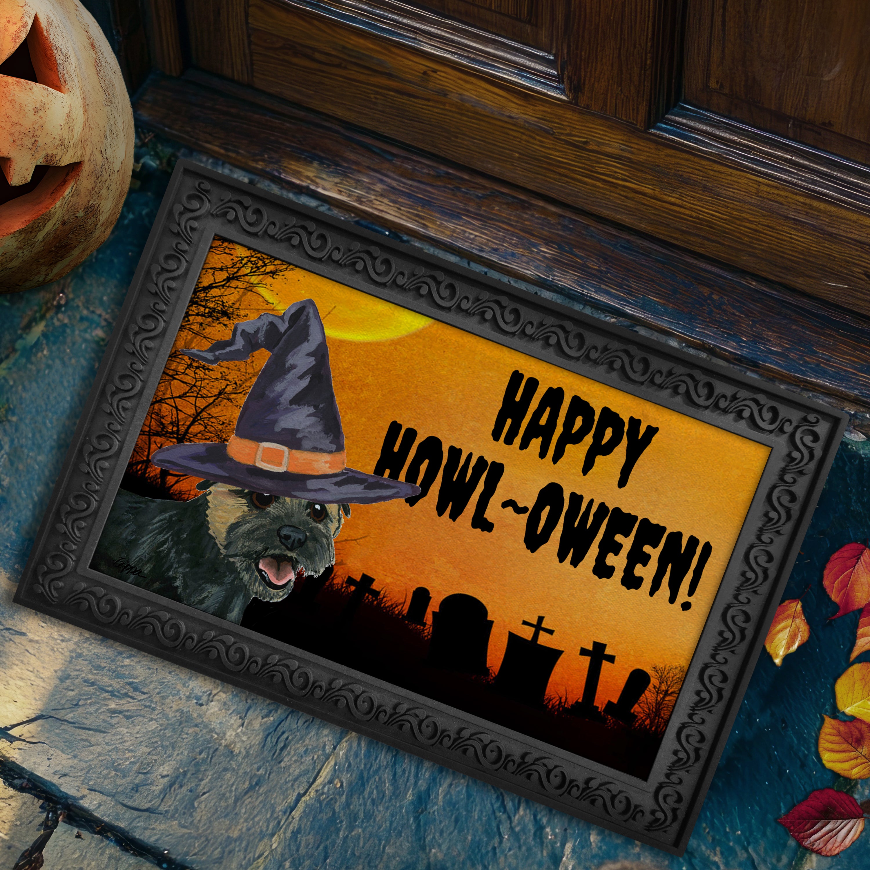 Halloween-themed doormat with a Border Terrier wearing a witch hat and 'Happy Howl-Oween!' text on a doorstep.