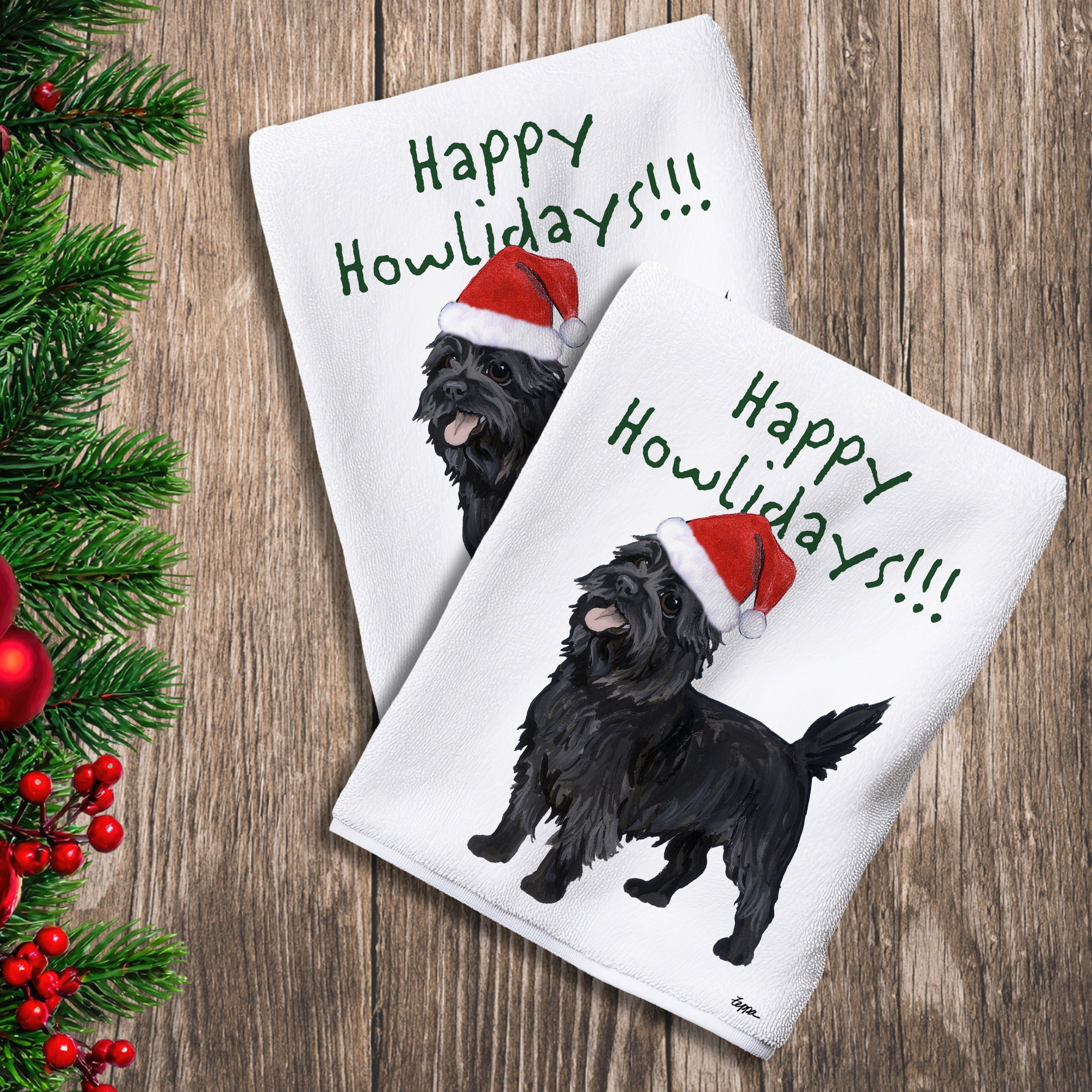 2 Kitchen Towels with a black Cairn Terrier in a Santa Hat and Happy Howlidays text.
