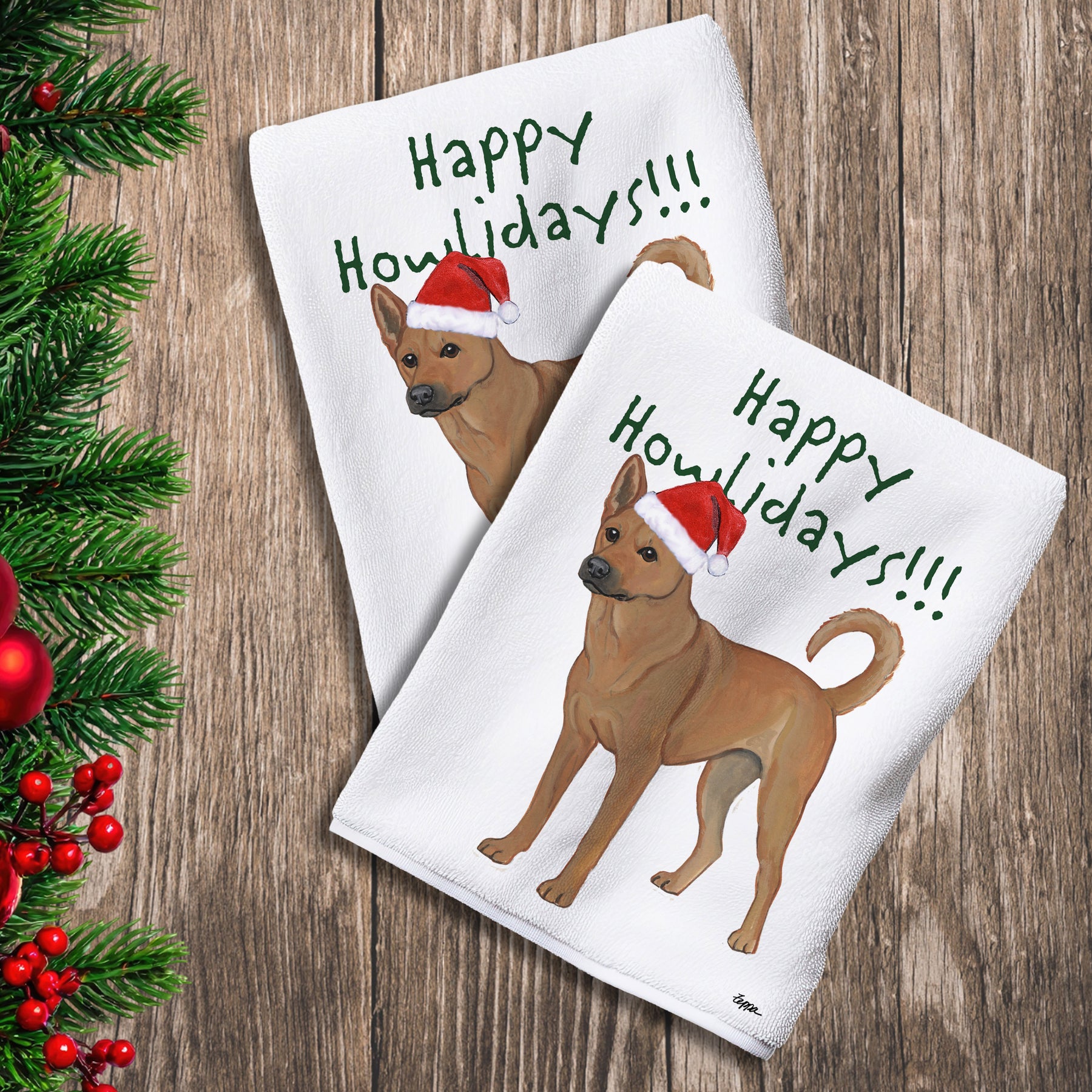 2 Kitchen Towels with a Carolina Dog in a Santa Hat and Happy Howlidays text.