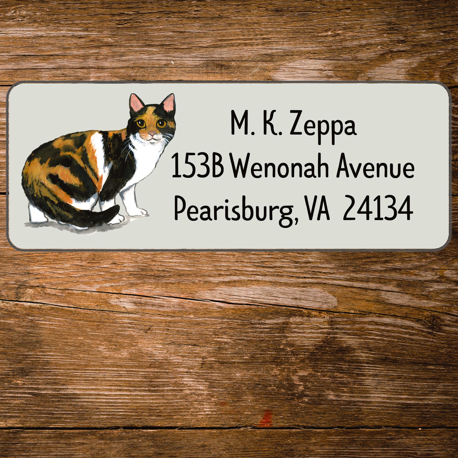Return address label with a Calico Cat illustration.