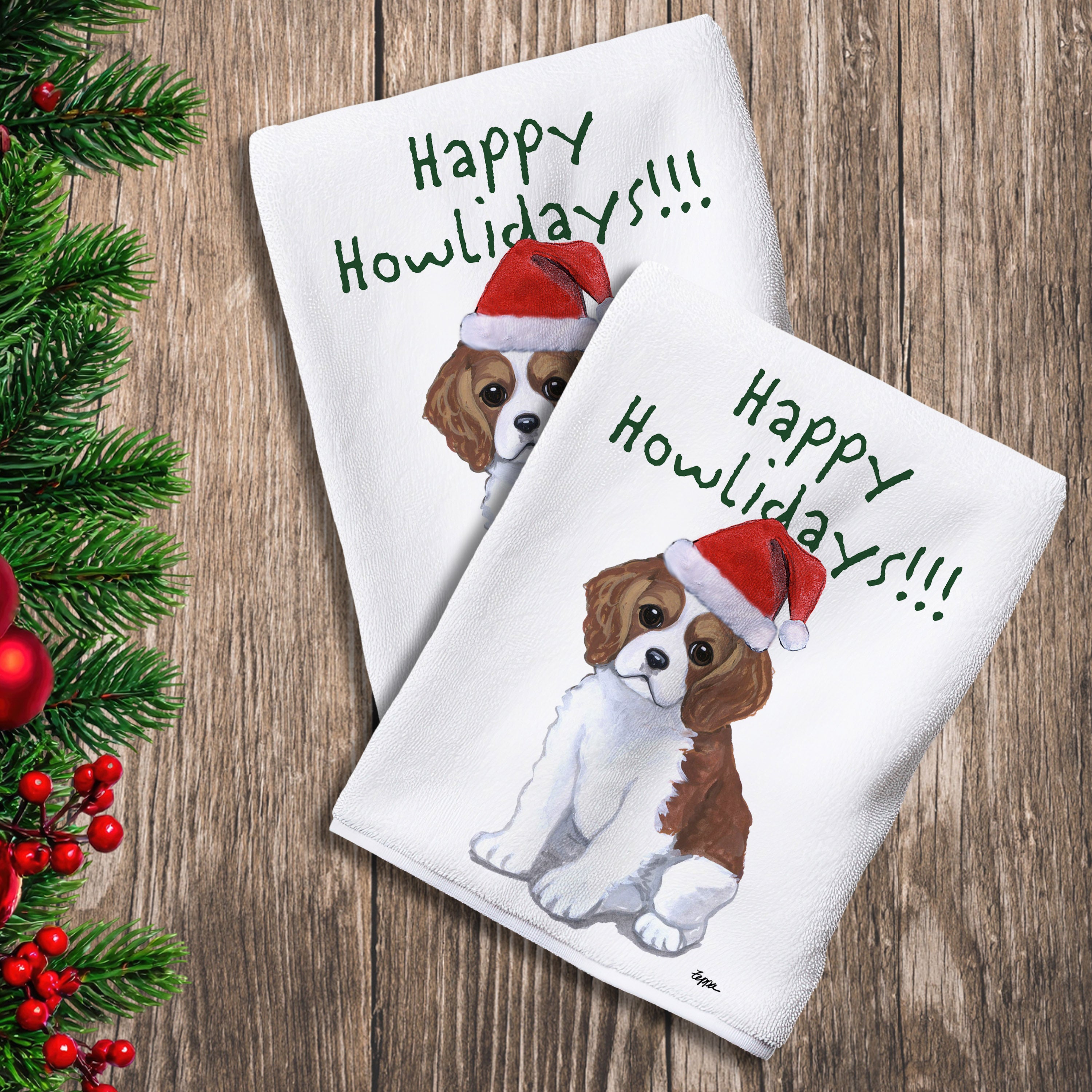 2 Kitchen Towels with a Cavalier King Charles Spaniel puppy in a Santa Hat and Happy Howlidays text.