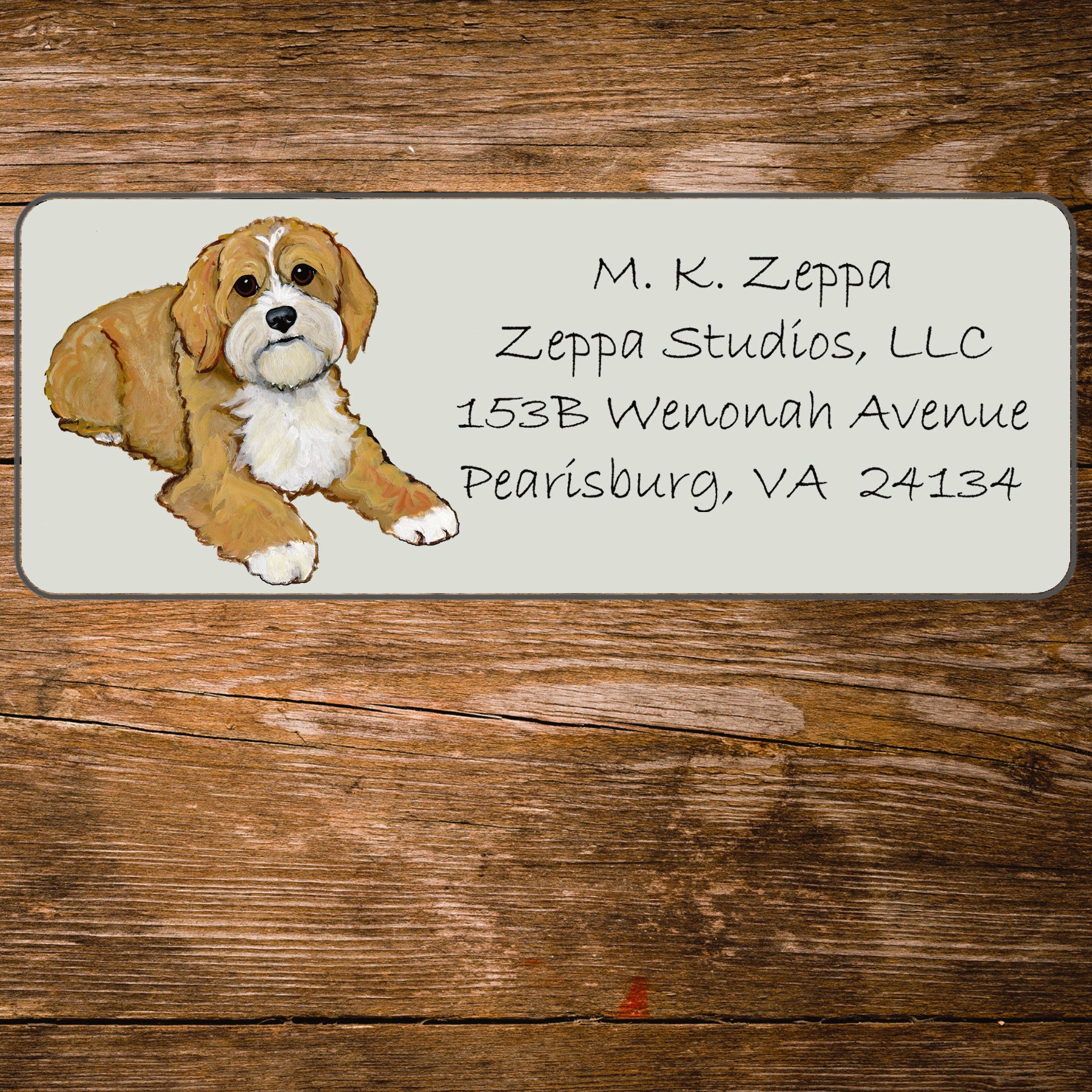 Return address label with an illustration of a Cavapoo.