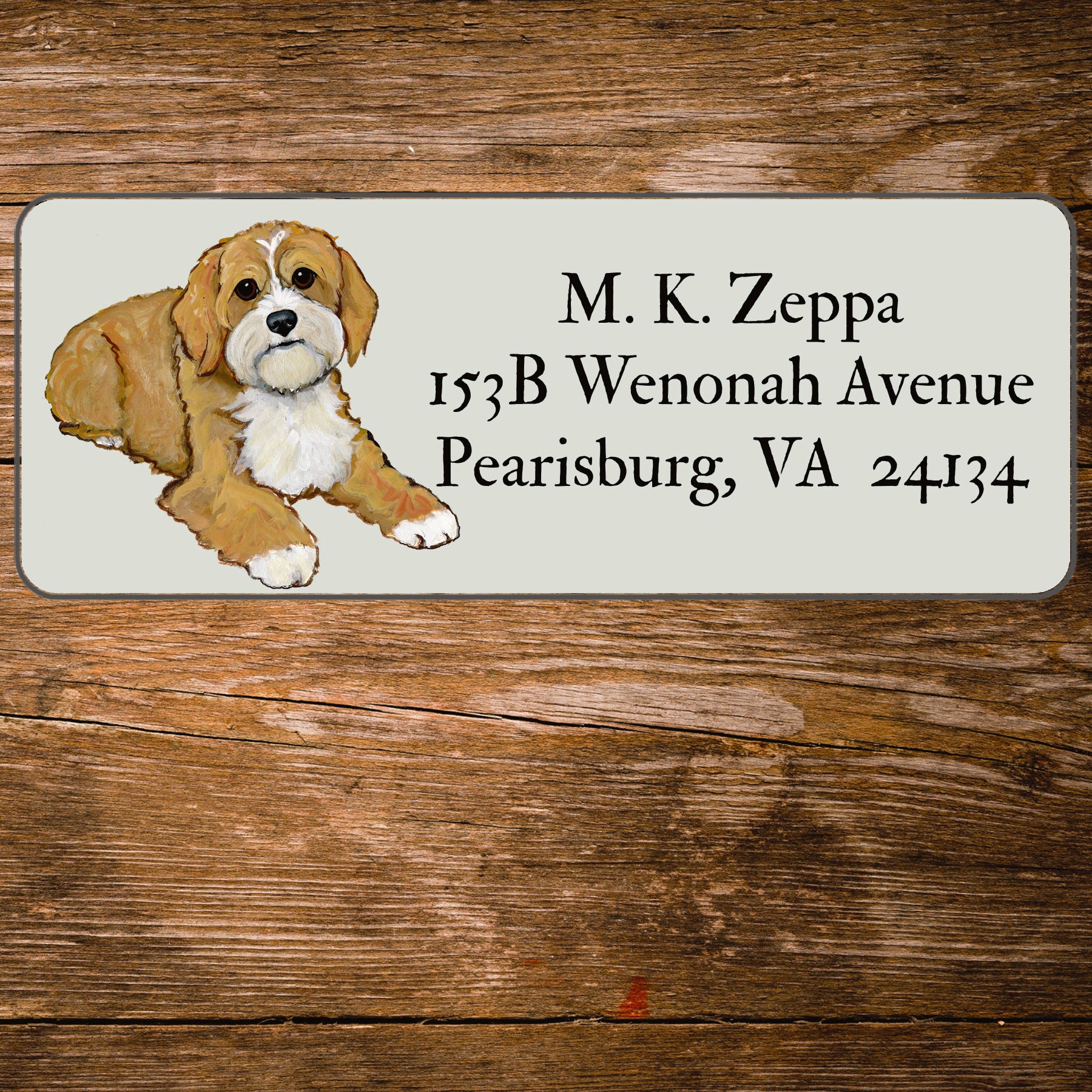 Return address label with an illustration of a Cavapoo.