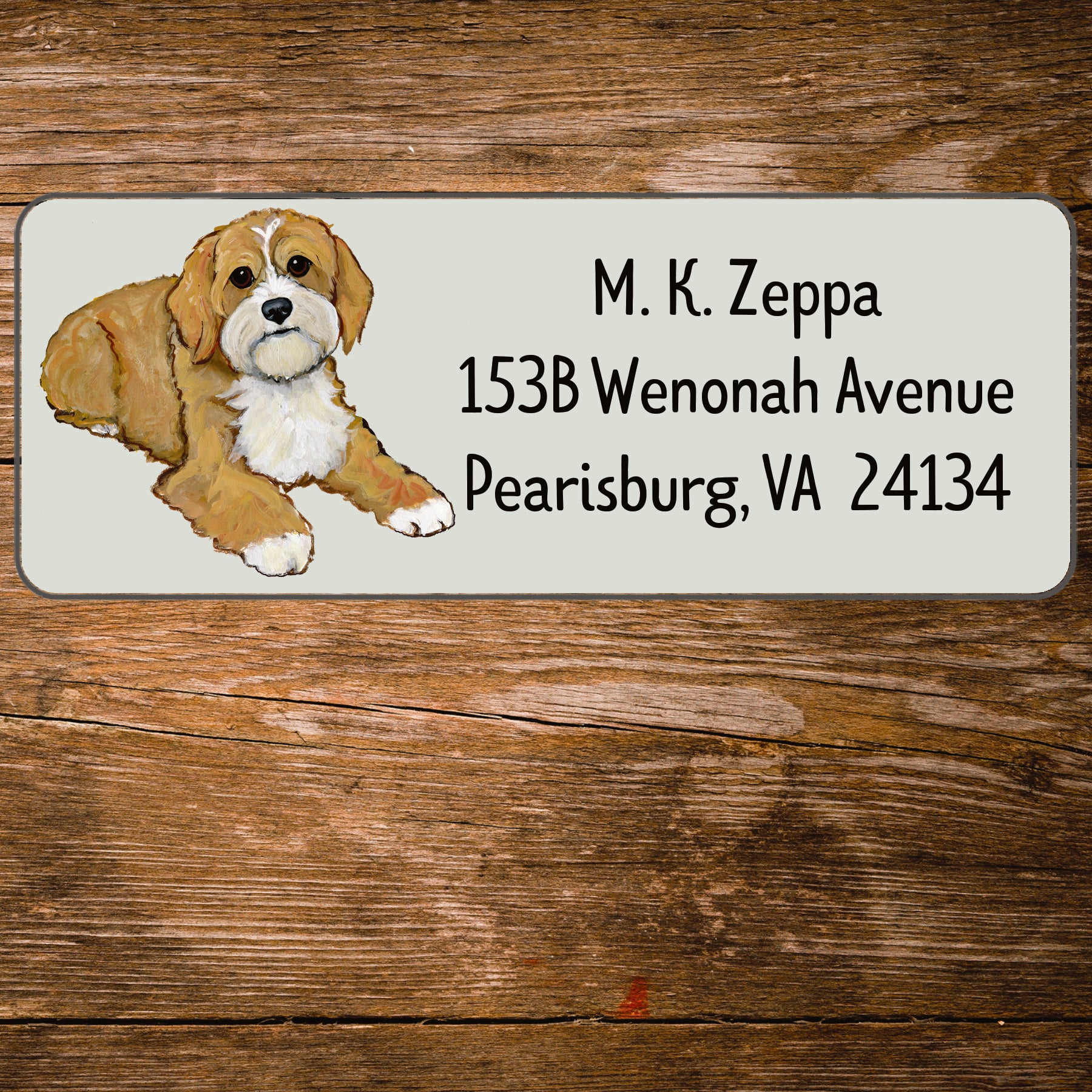 Return address label with an illustration of a Cavapoo.
