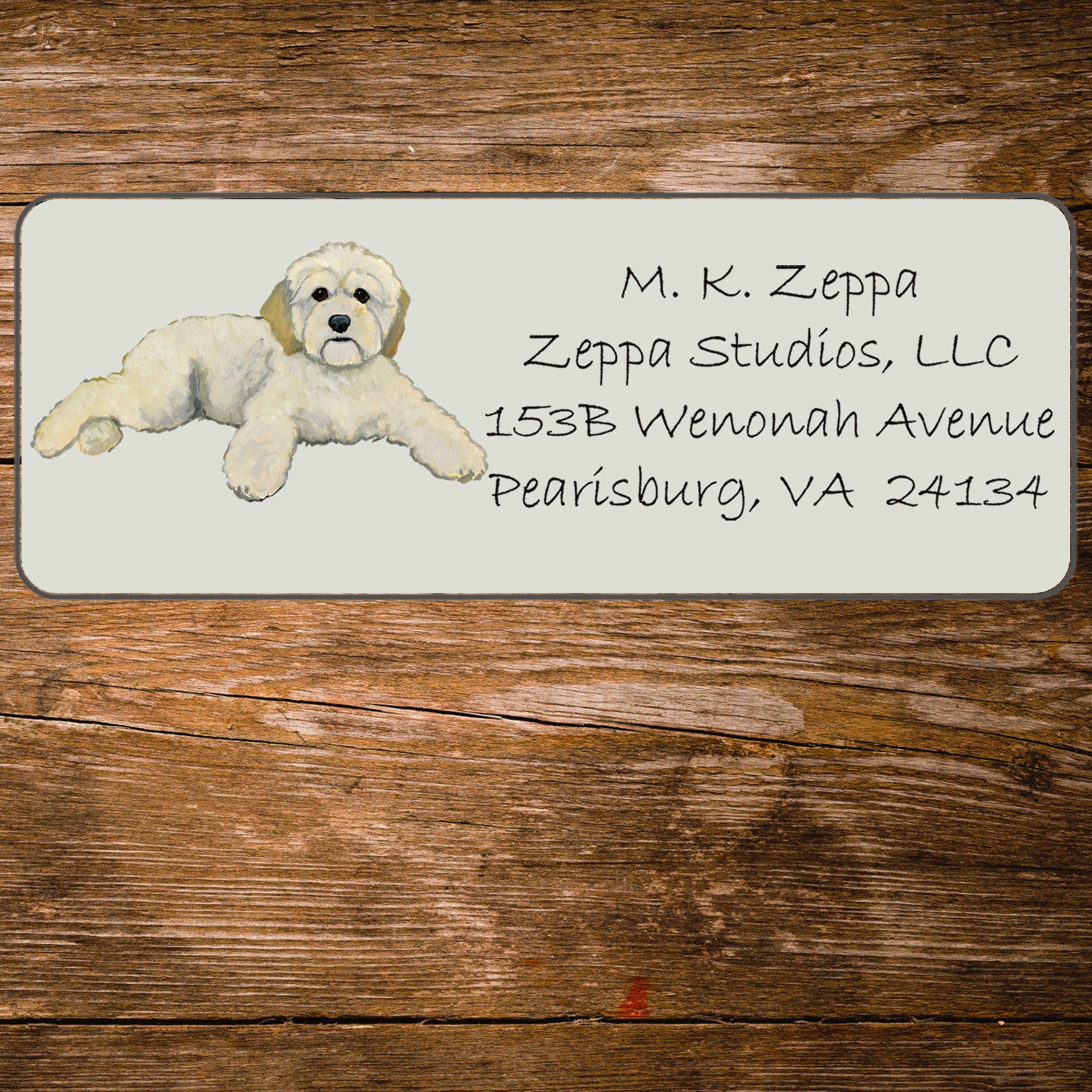 Return address label with an illustration of a Cockapoo.