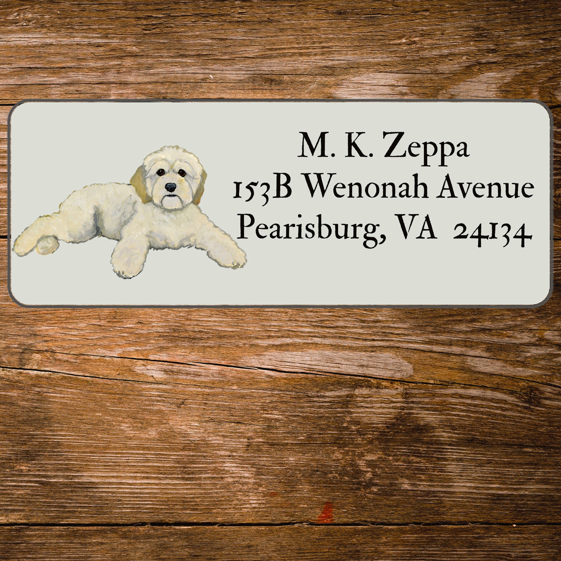 Return address label with an illustration of a Cockapoo.