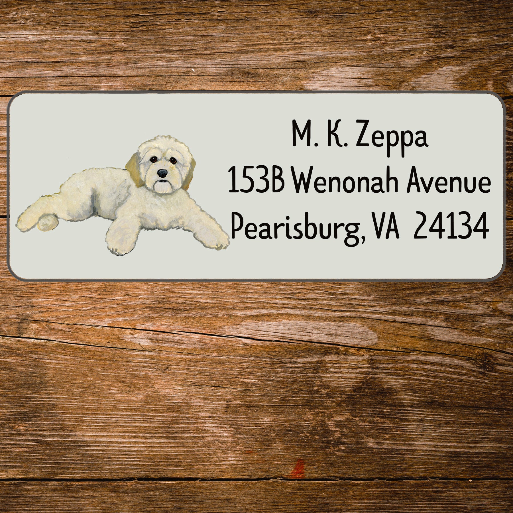 Return address label with an illustration of a Cockapoo.