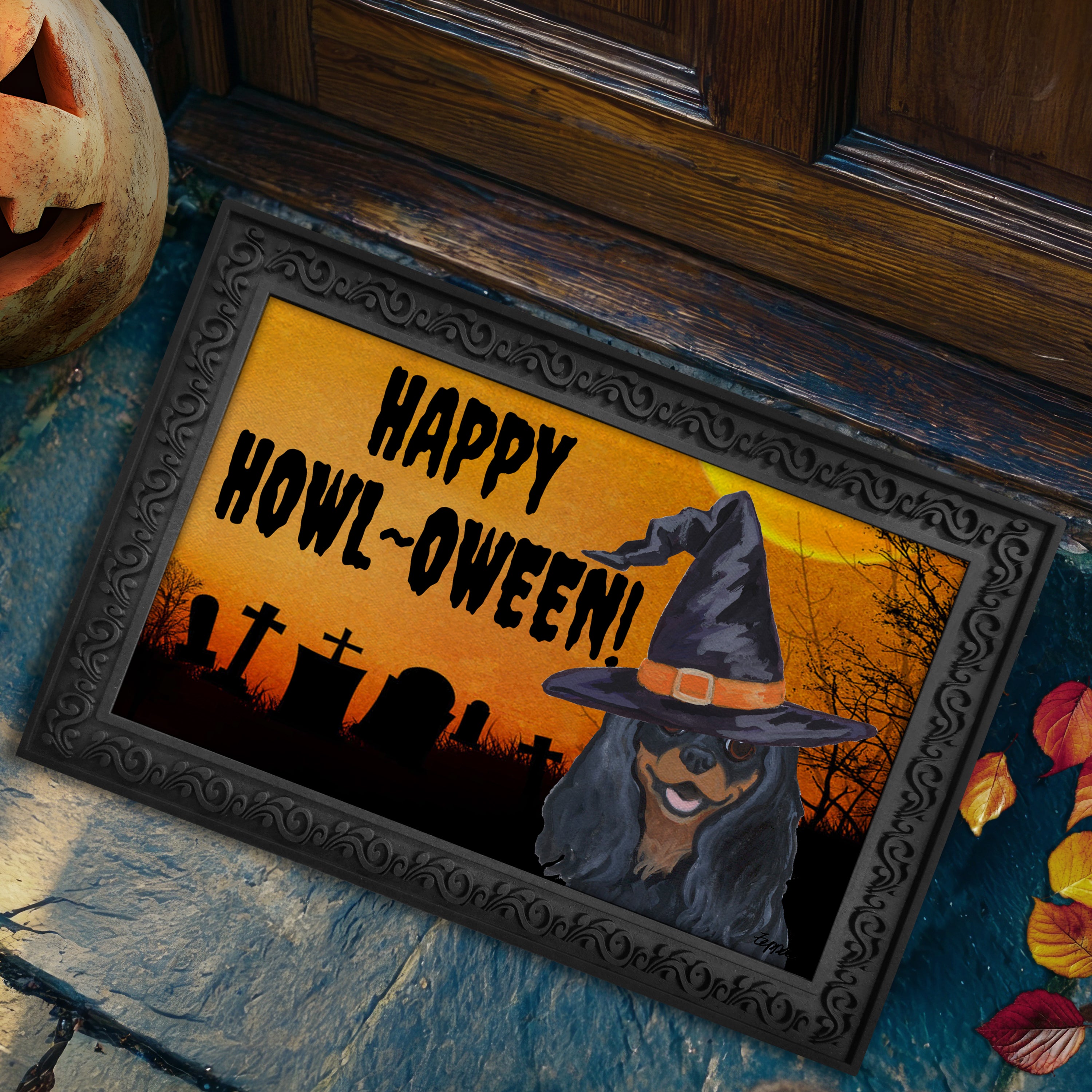 Halloween-themed doormat with a Cavalier King Charles Spaniel wearing a witch hat and 'Happy Howl-Oween!' text on a doorstep.