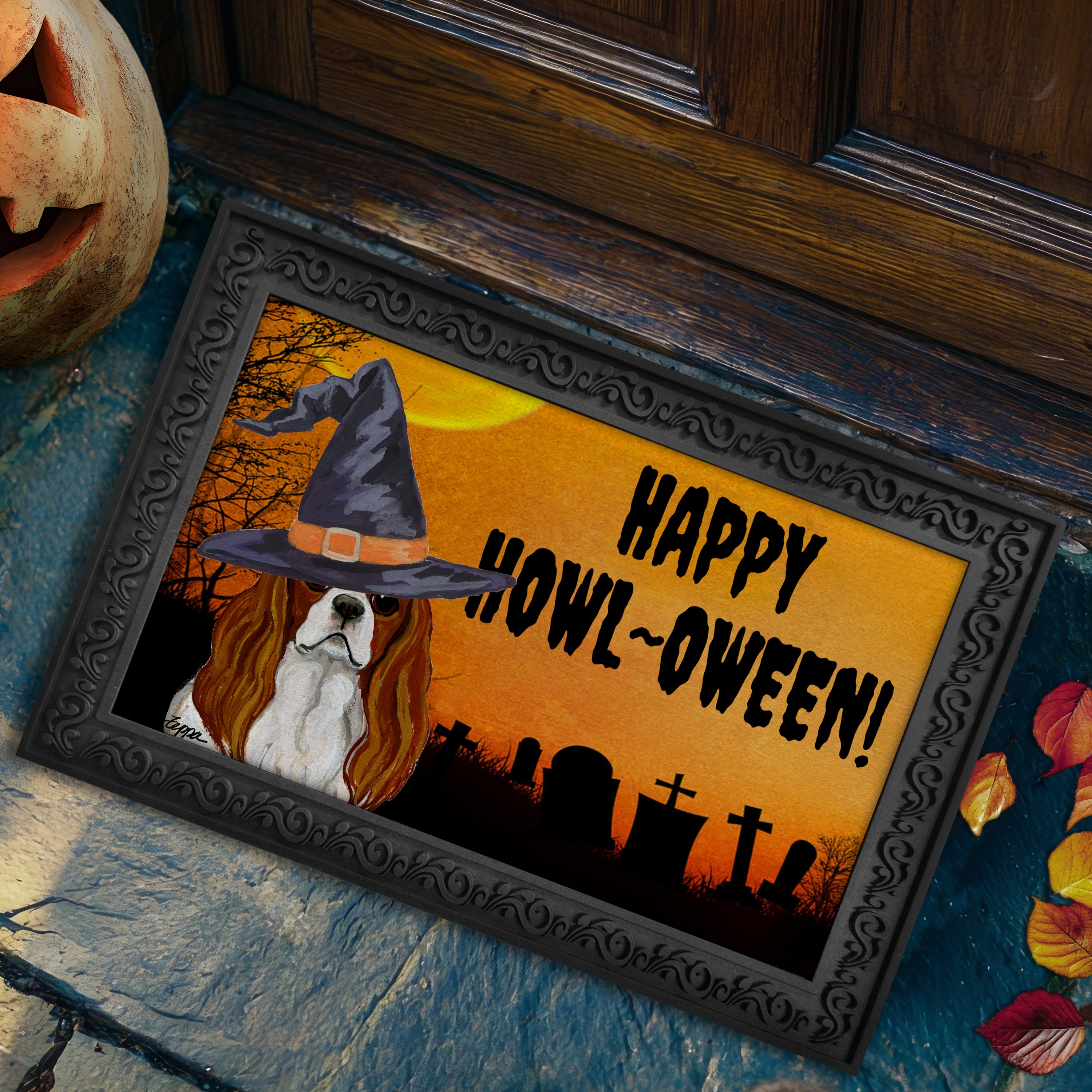 Halloween-themed doormat with a Cavalier King Charles Spaniel wearing a witch hat and 'Happy Howl-Oween!' text on a doorstep.