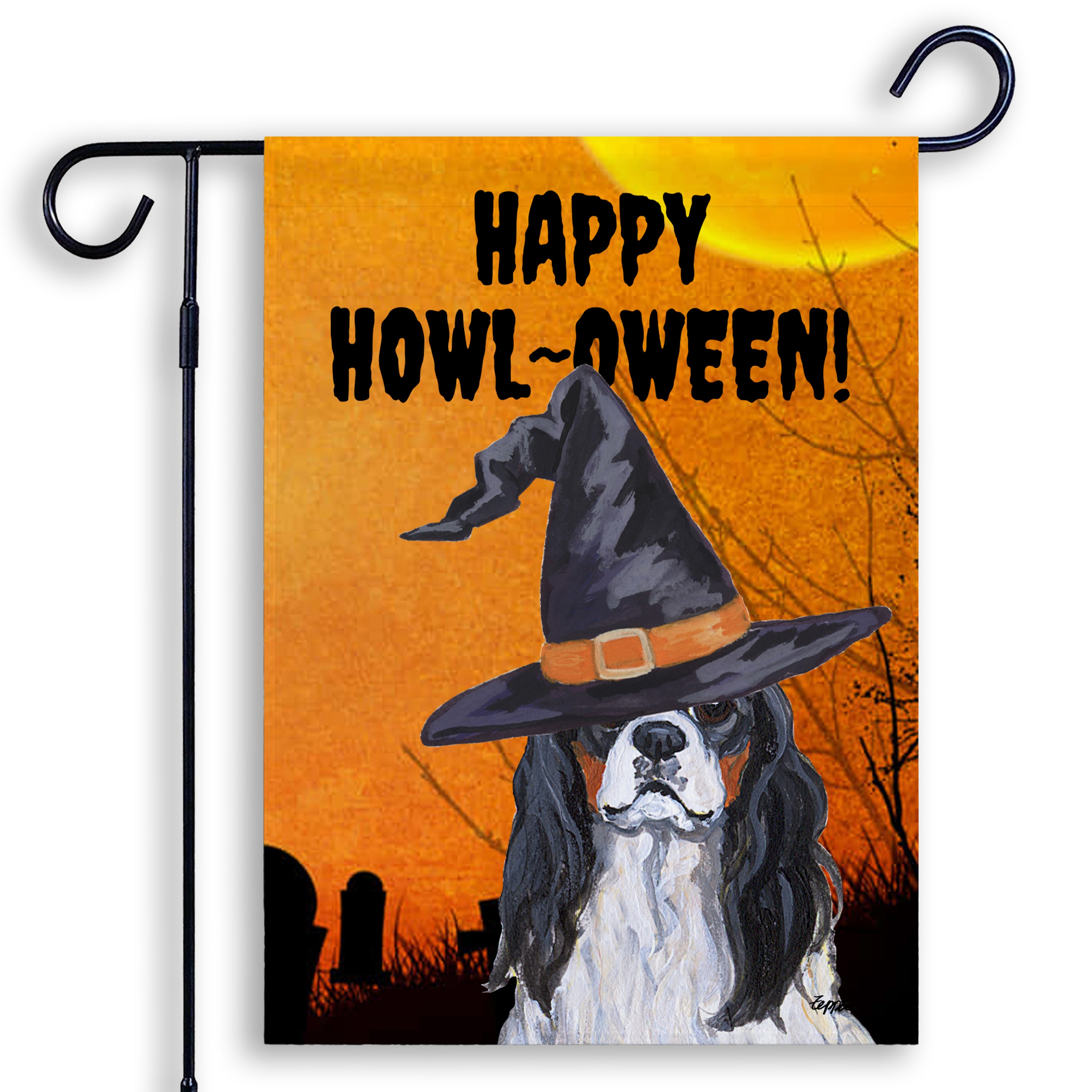 Halloween-themed garden flag with a Cavalier KIng Charles Spaniel wearing a witch hat and 'Happy Howl-Oween!' text on an orange background.