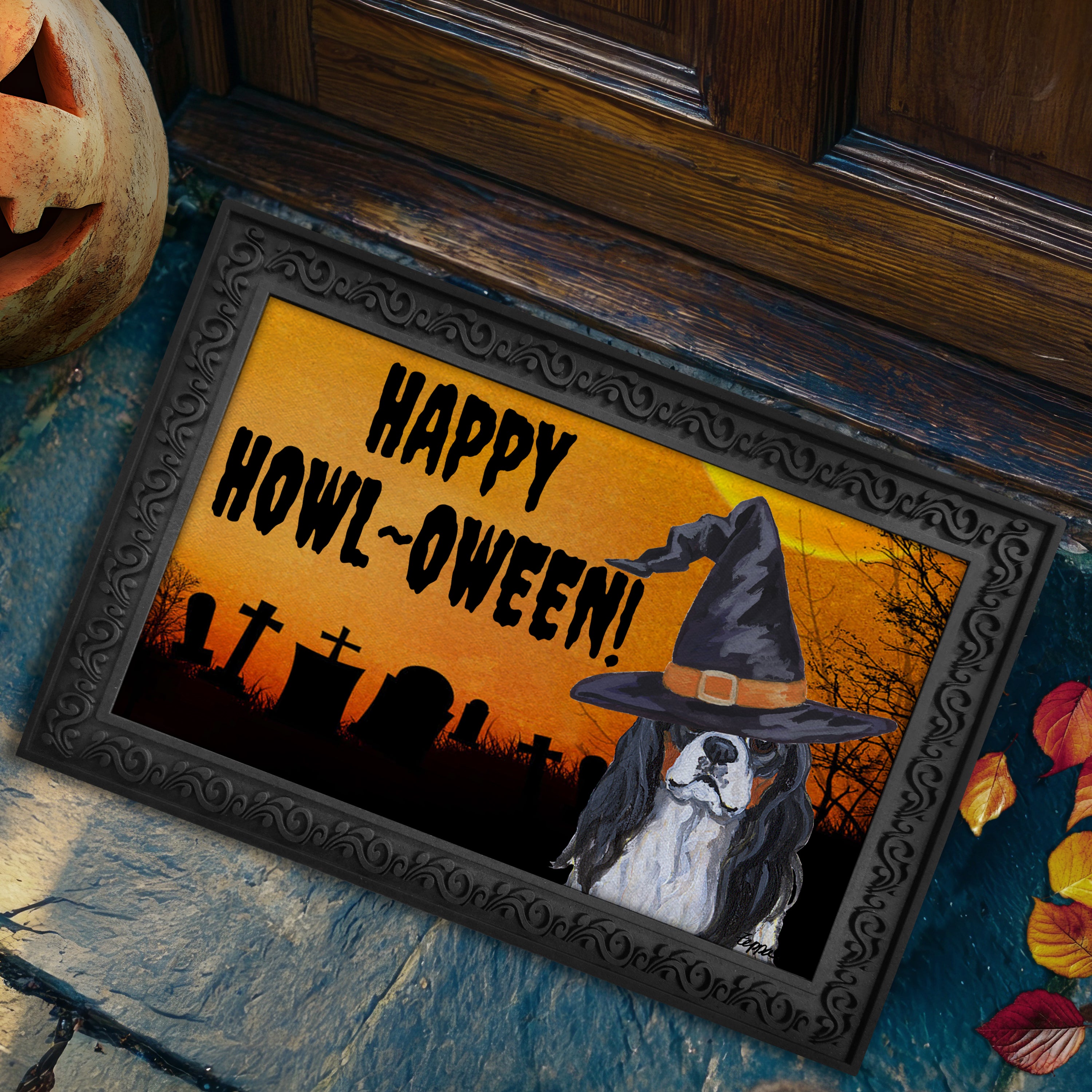 Halloween-themed doormat with a Cavalier King Charles Spaniel wearing a witch hat and 'Happy Howl-Oween!' text on a doorstep.