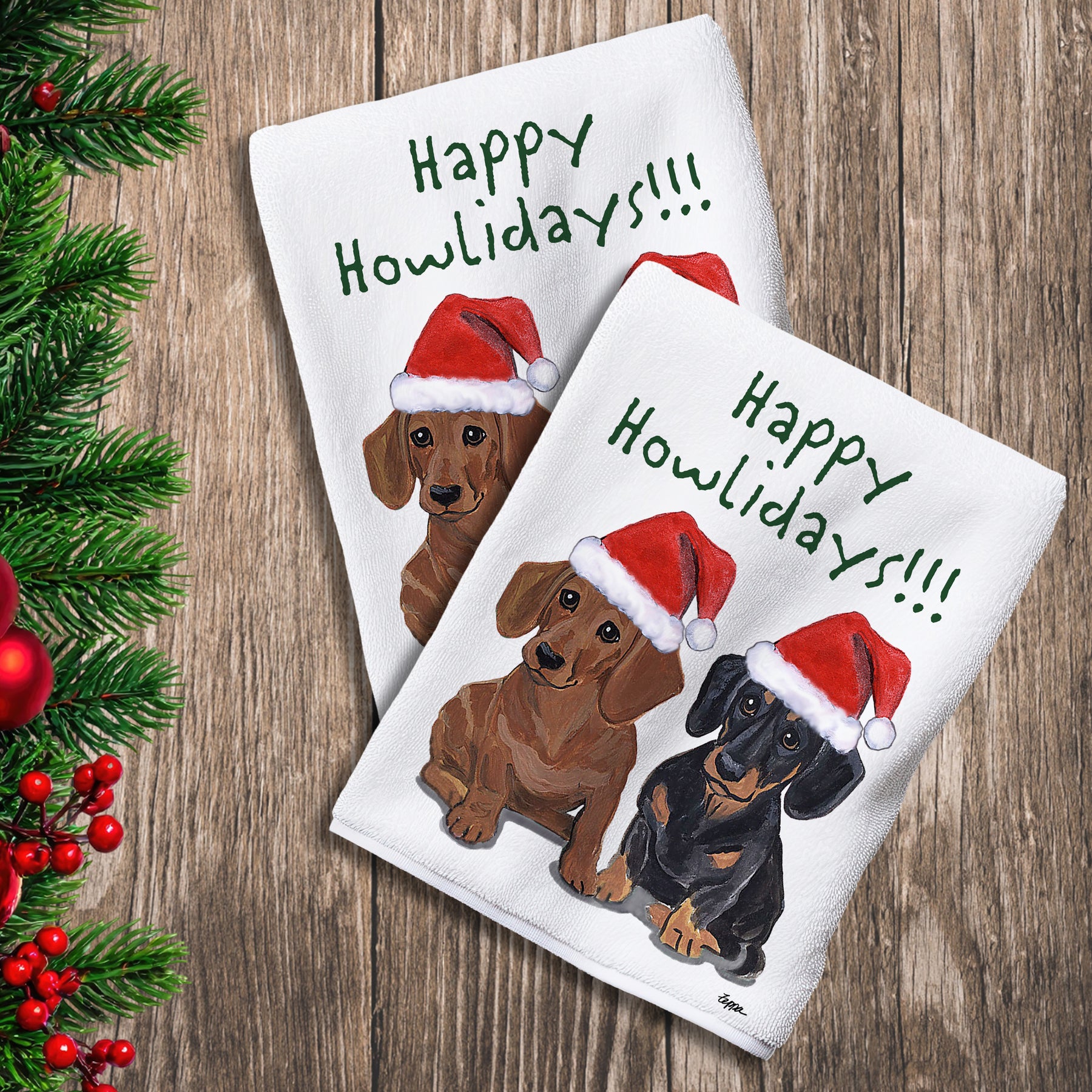 2 Kitchen Towels with a pair of Dachshunds in Santa Hats and Happy Howlidays text. 