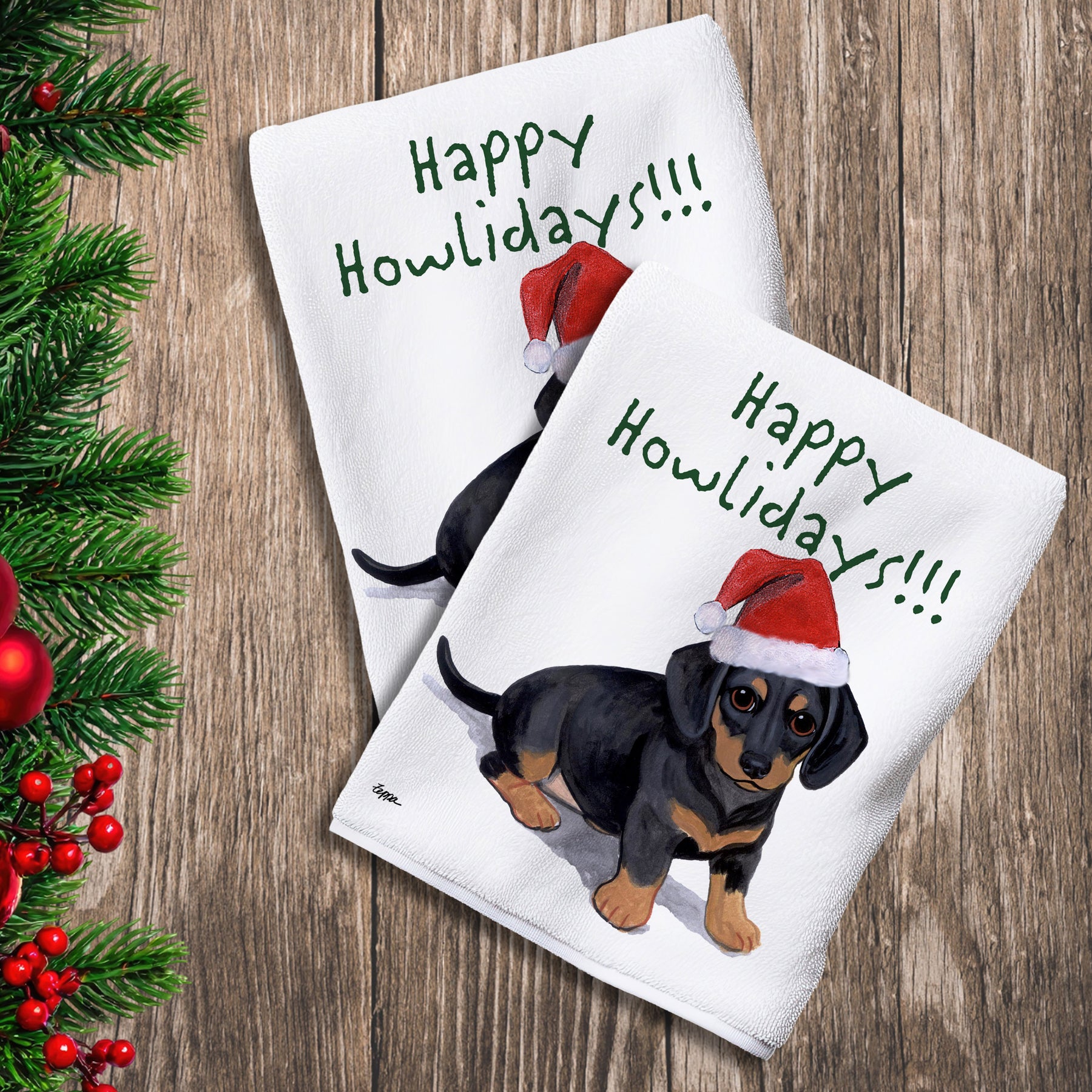 2 Kitchen Towels with a black and tan Dachshund puppy in a Santa Hat and Happy Howlidays text. 
