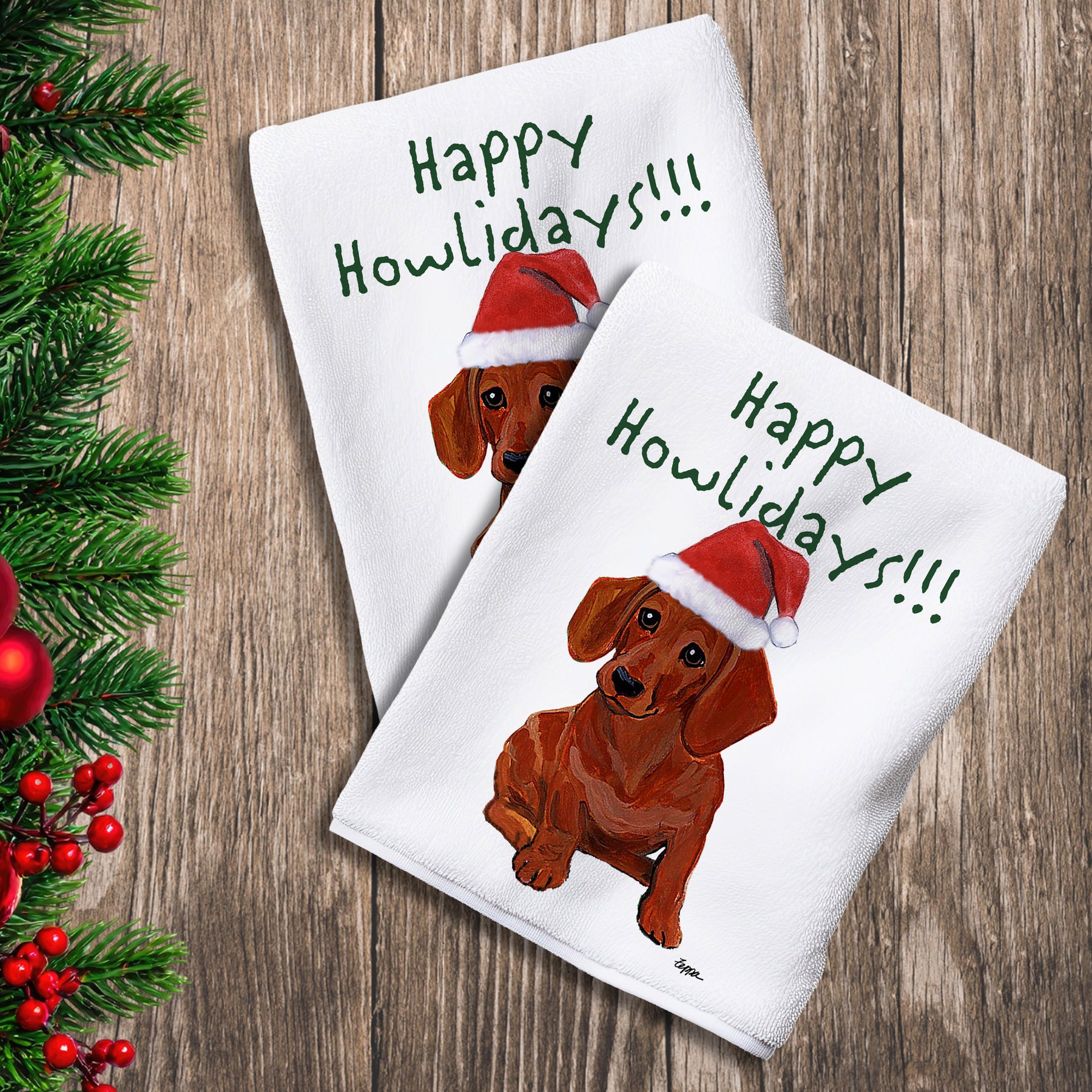2 Kitchen Towels with a red Dachshund in a Santa Hat and Happy Howlidays text. 