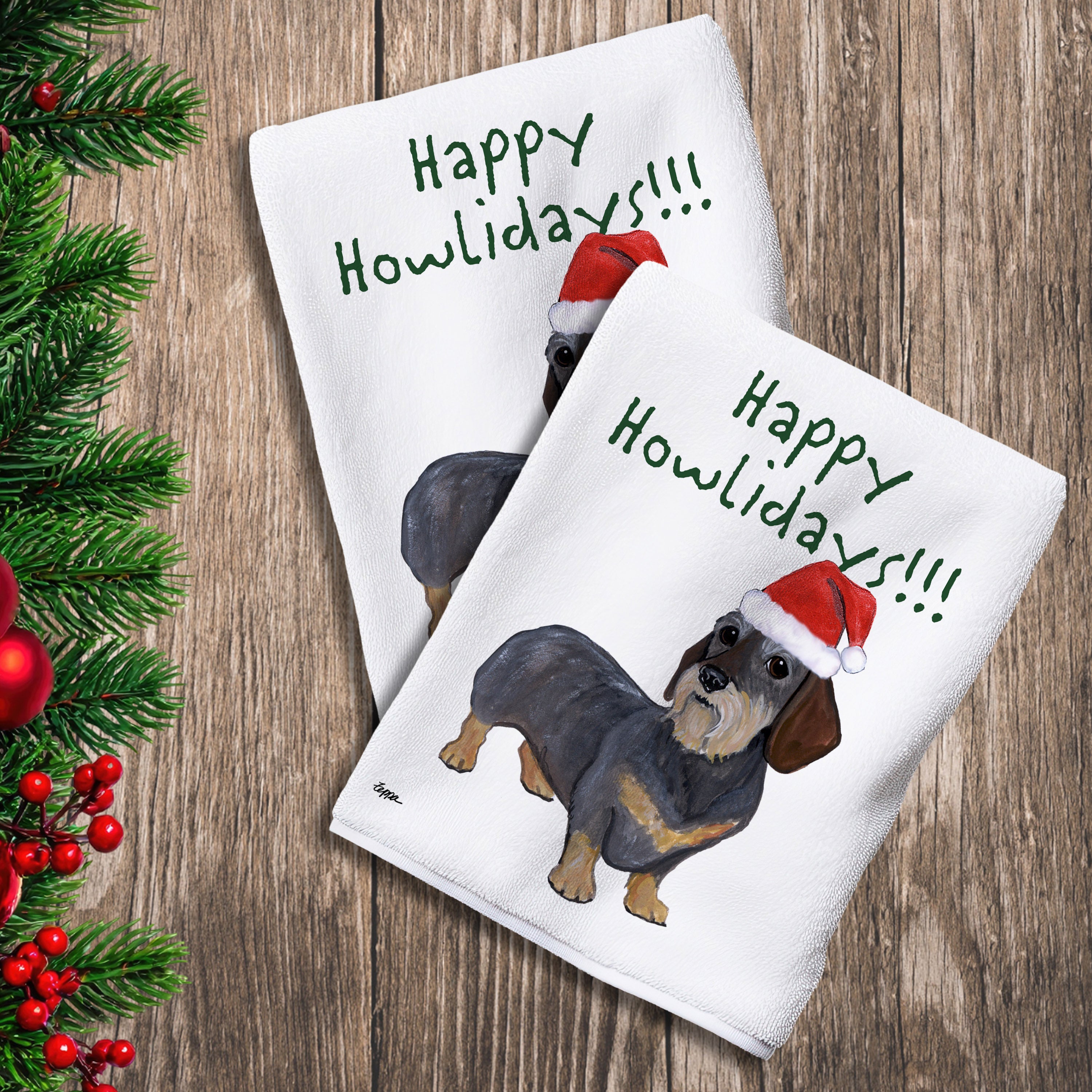 2 Kitchen Towels with a wirehaired Dachshund in a Santa Hat and Happy Howlidays text. 