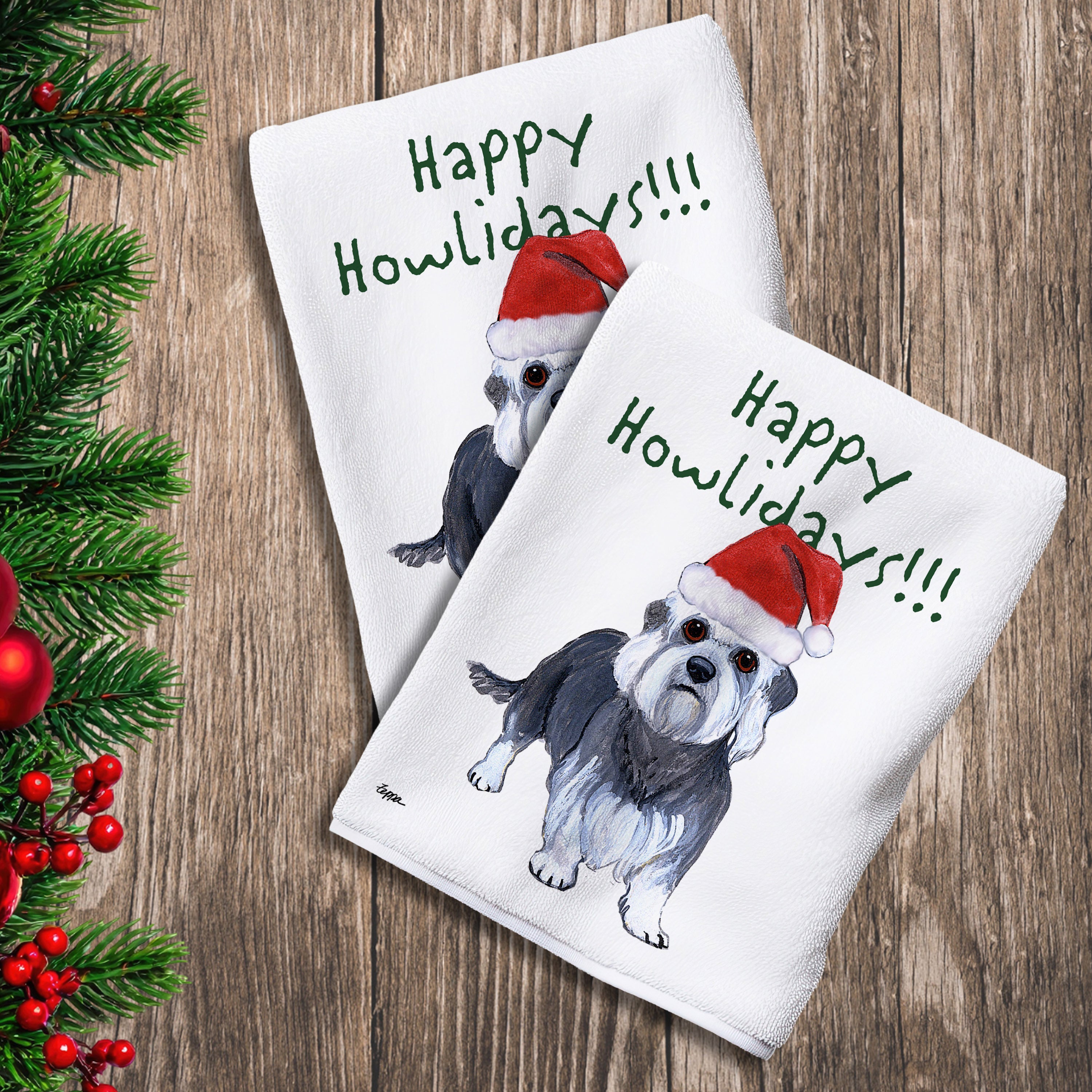 2 Kitchen Towels with a Dandi Dinmont Terrier in a Santa Hat and Happy Howlidays text. 