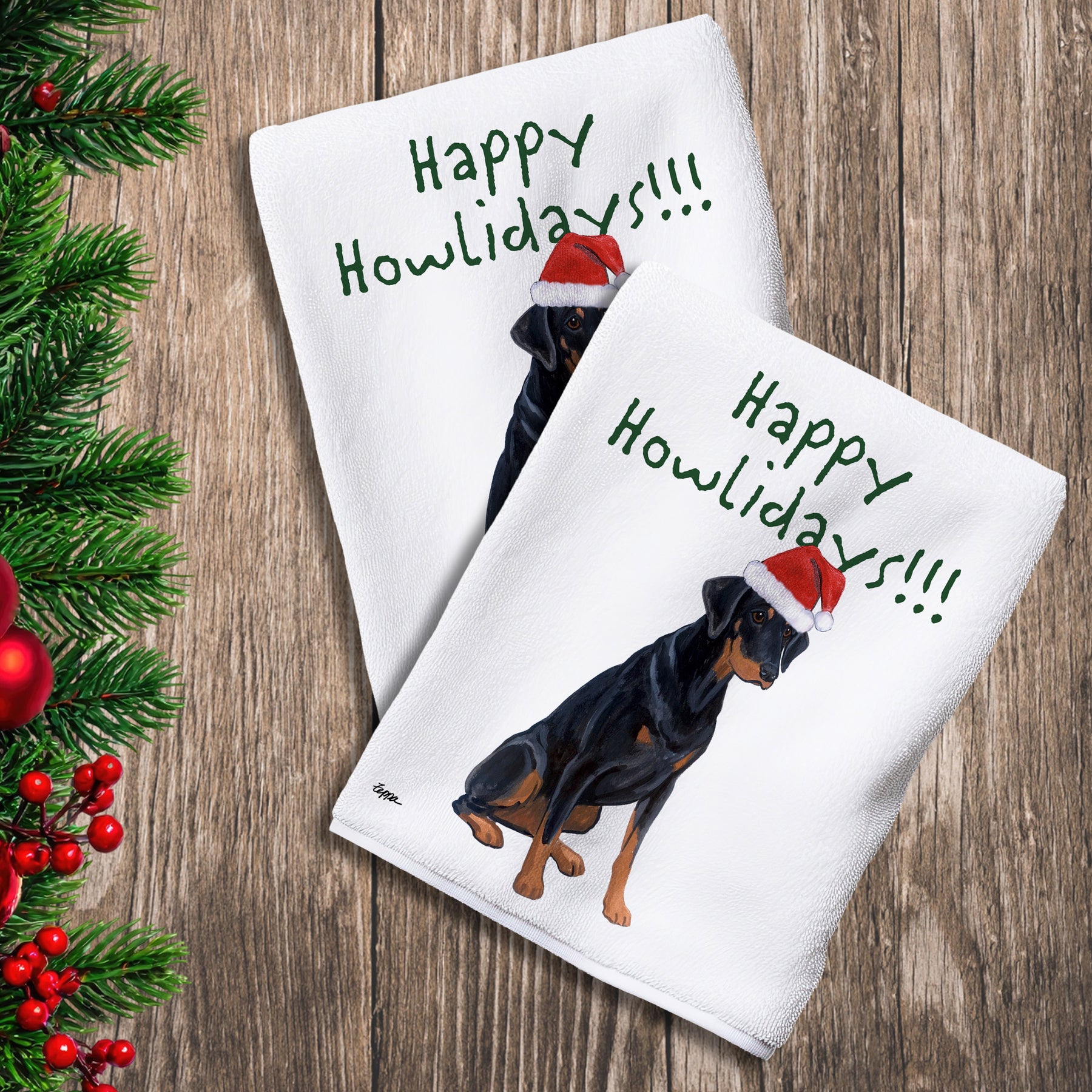2 Kitchen Towels with a Doberman with natural ears in a Santa Hat and Happy Howlidays text. 