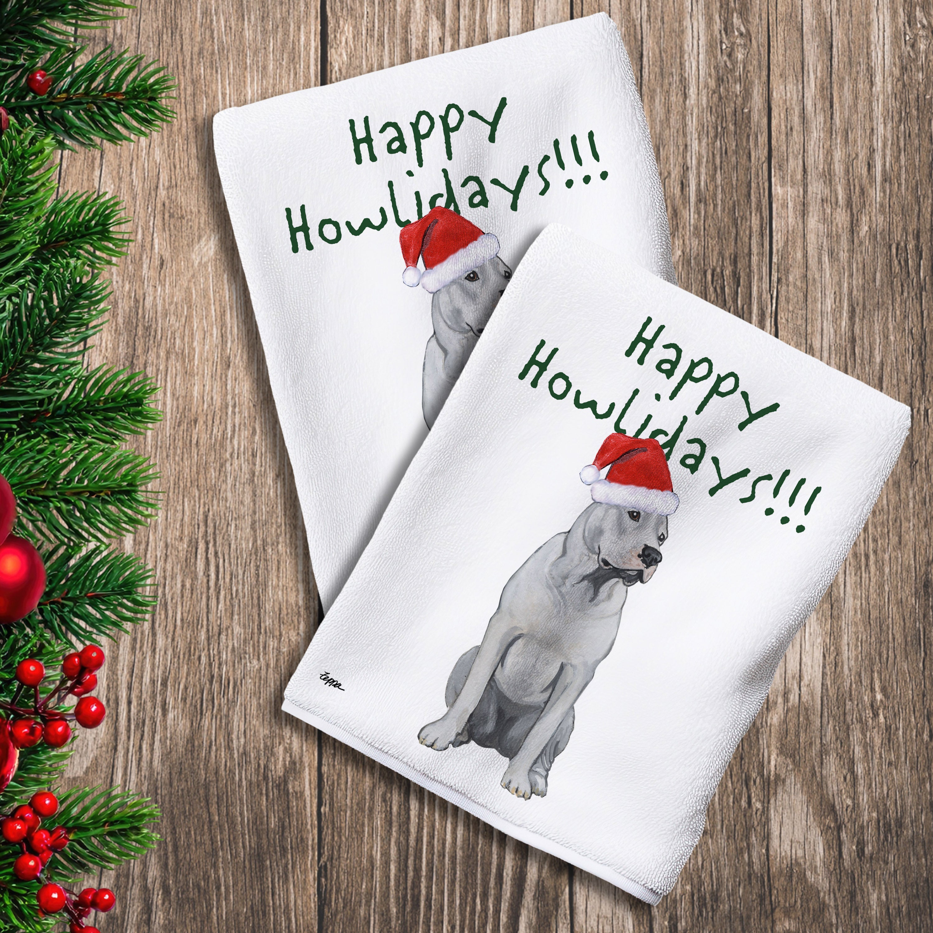 2 Kitchen Towels with a Dogo Argentino in a Santa Hat and Happy Howlidays text.