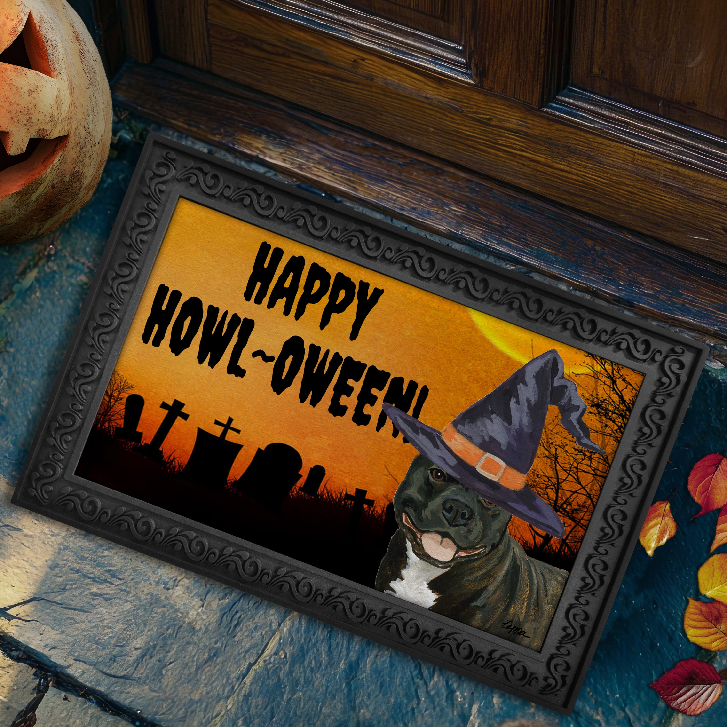 Halloween-themed doormat with a English Staffordshire Terrier wearing a witch hat and 'Happy Howl-Oween!' text on a doorstep.