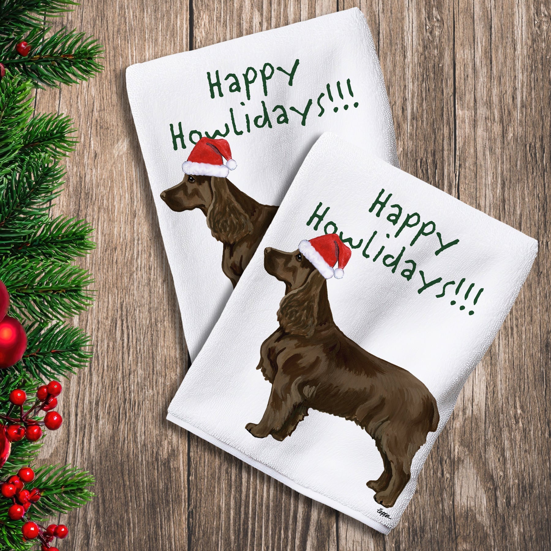 2 Kitchen Towels with a Field Spaniel in a Santa Hat and Happy Howlidays text. 