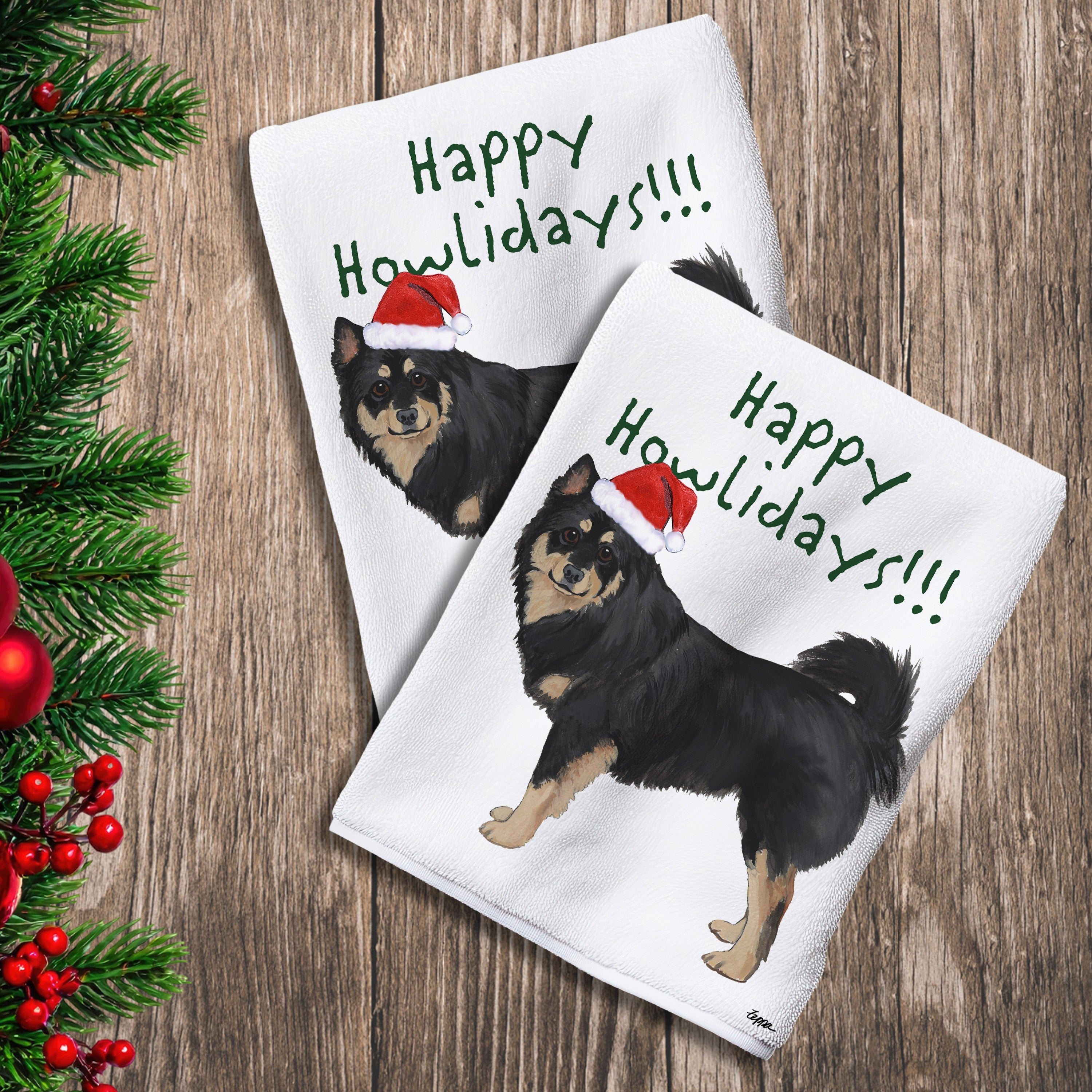 2 Kitchen Towels with a Finnish Lapphund in a Santa Hat and Happy Howlidays text.