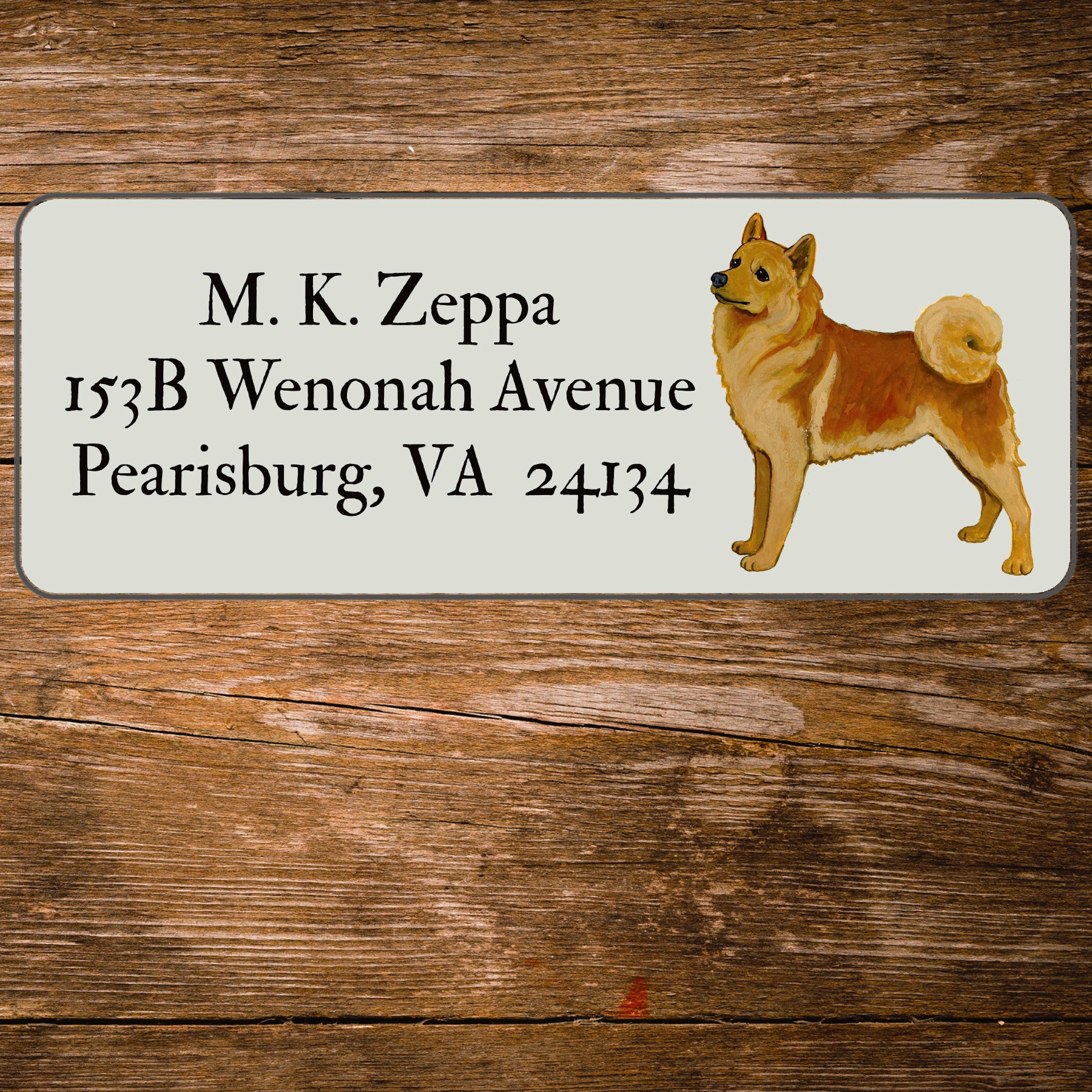 Return address label with an illustration of a Finnish Spitz