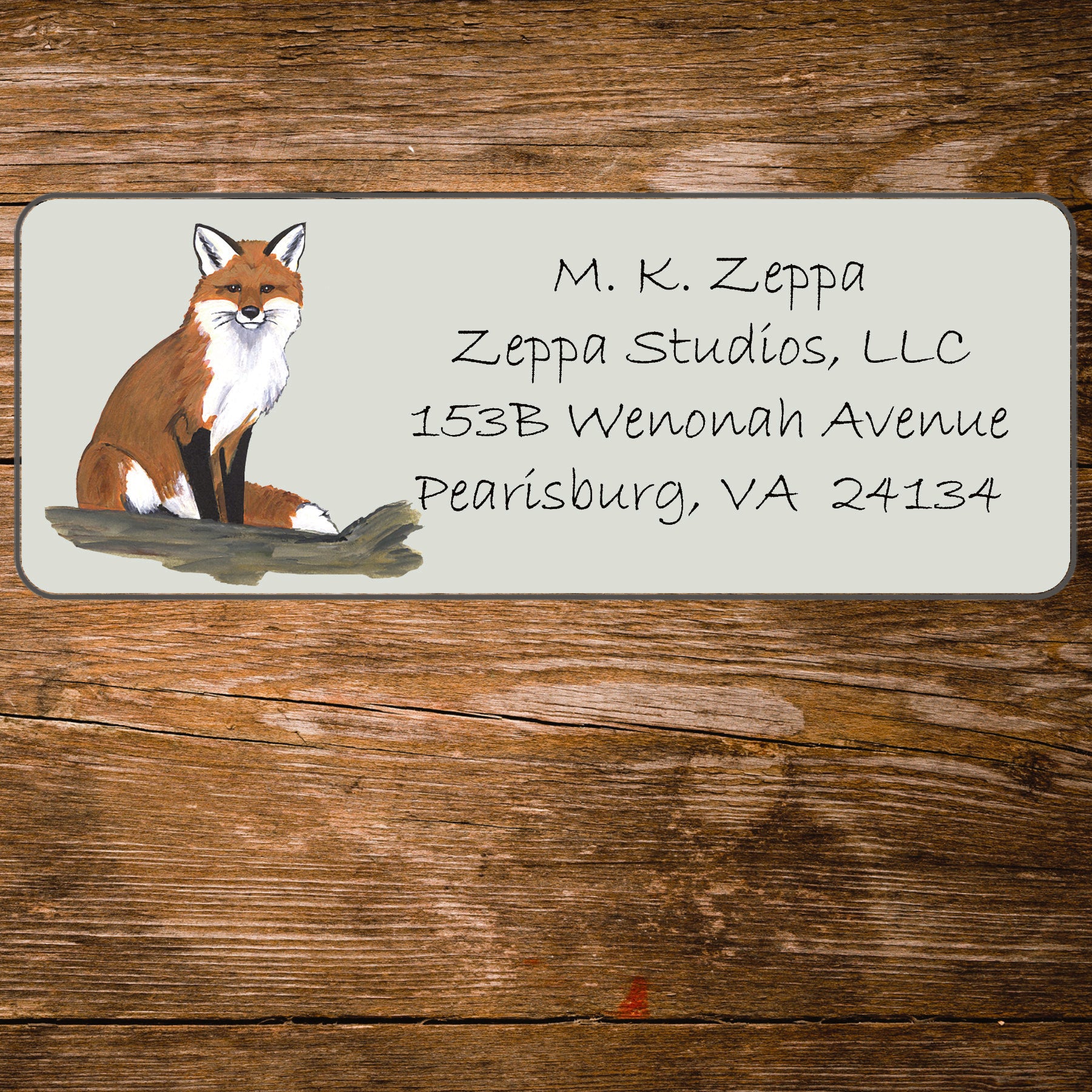 Address label with Seated Fox illustration on a wooden background