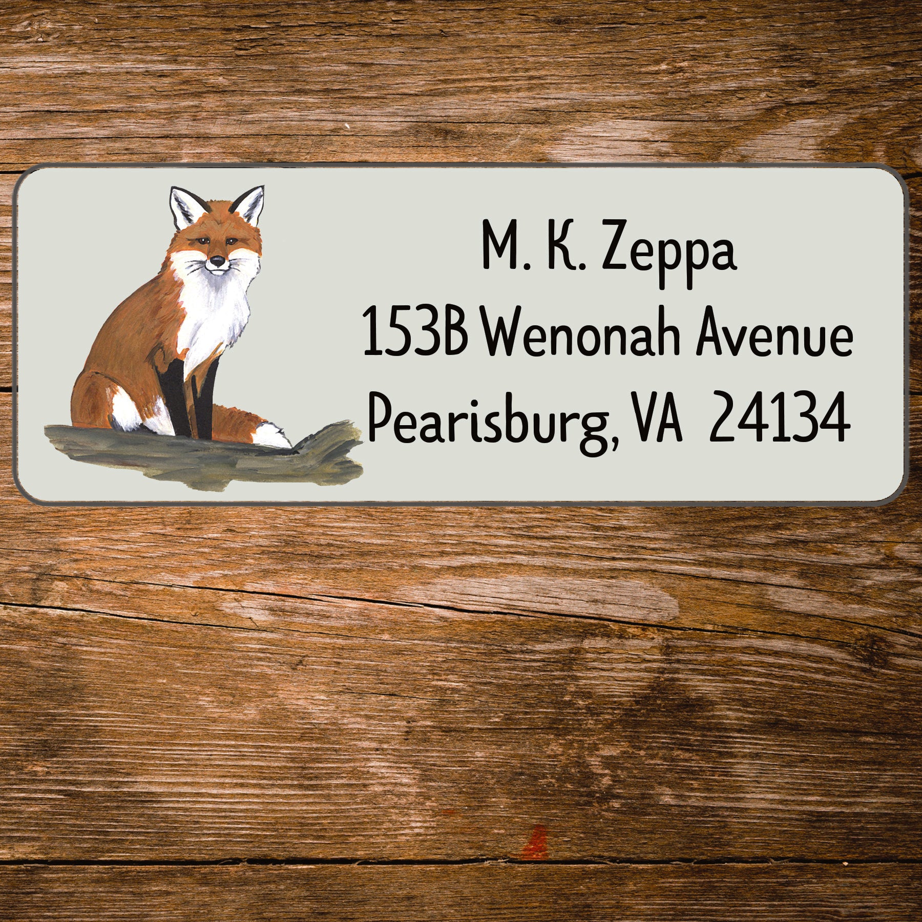 Address label with Seated Fox illustration on a wooden background