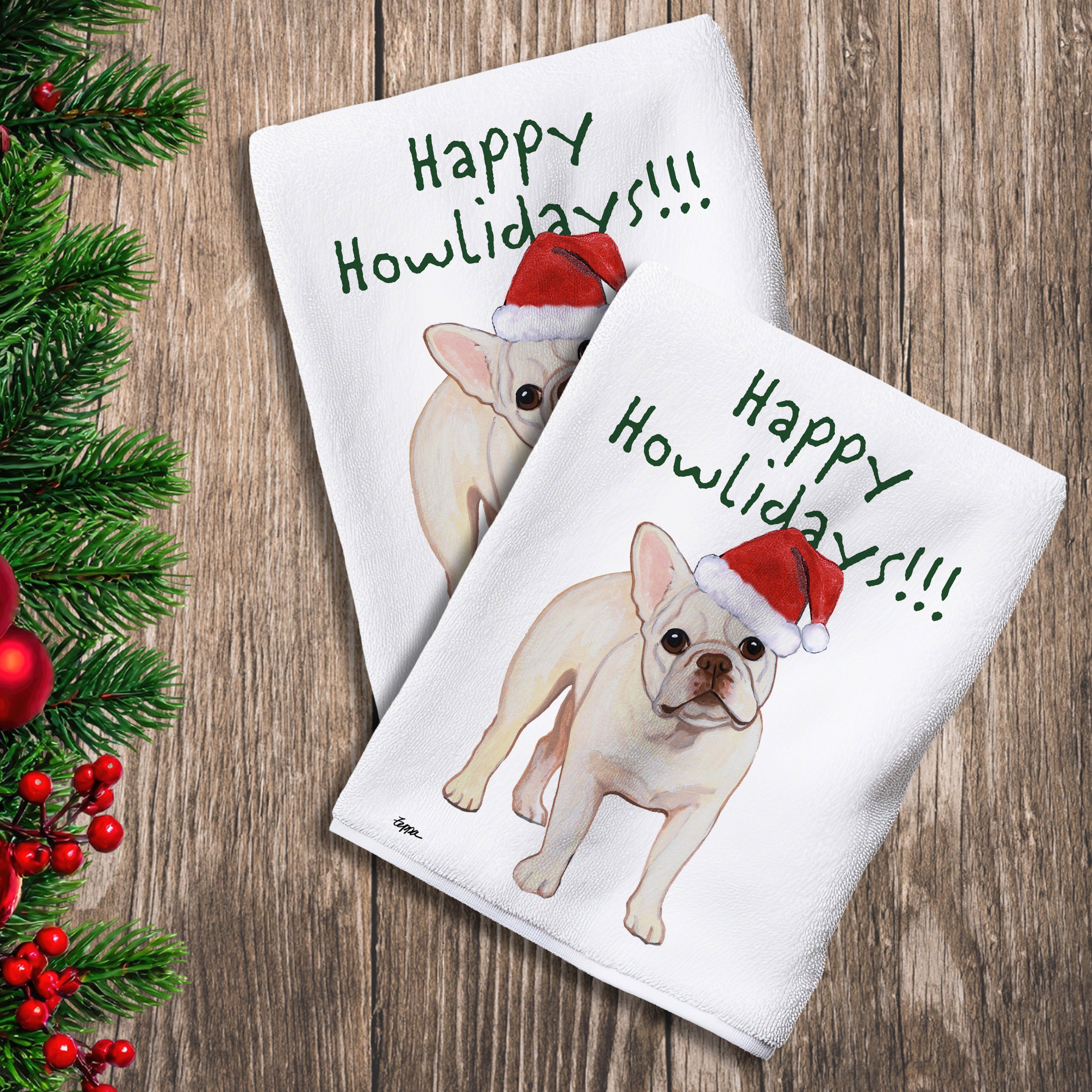 2 Kitchen Towels with a cream French Bulldog in a Santa Hat and Happy Howlidays text. 