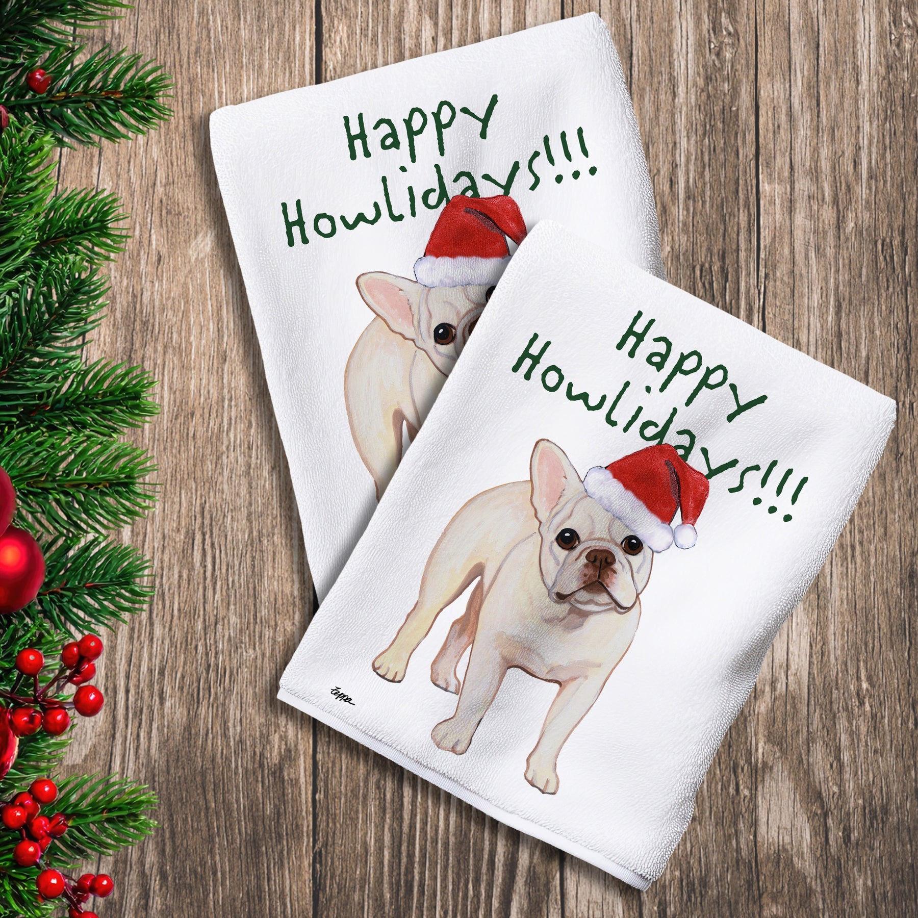 2 Kitchen Towels with a cream French Bulldog in a Santa Hat and Happy Howlidays text. 