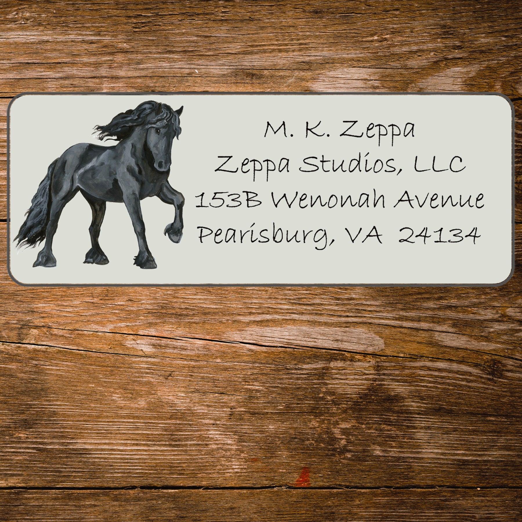 Return address label with an illustration of a Friesian Horse.
